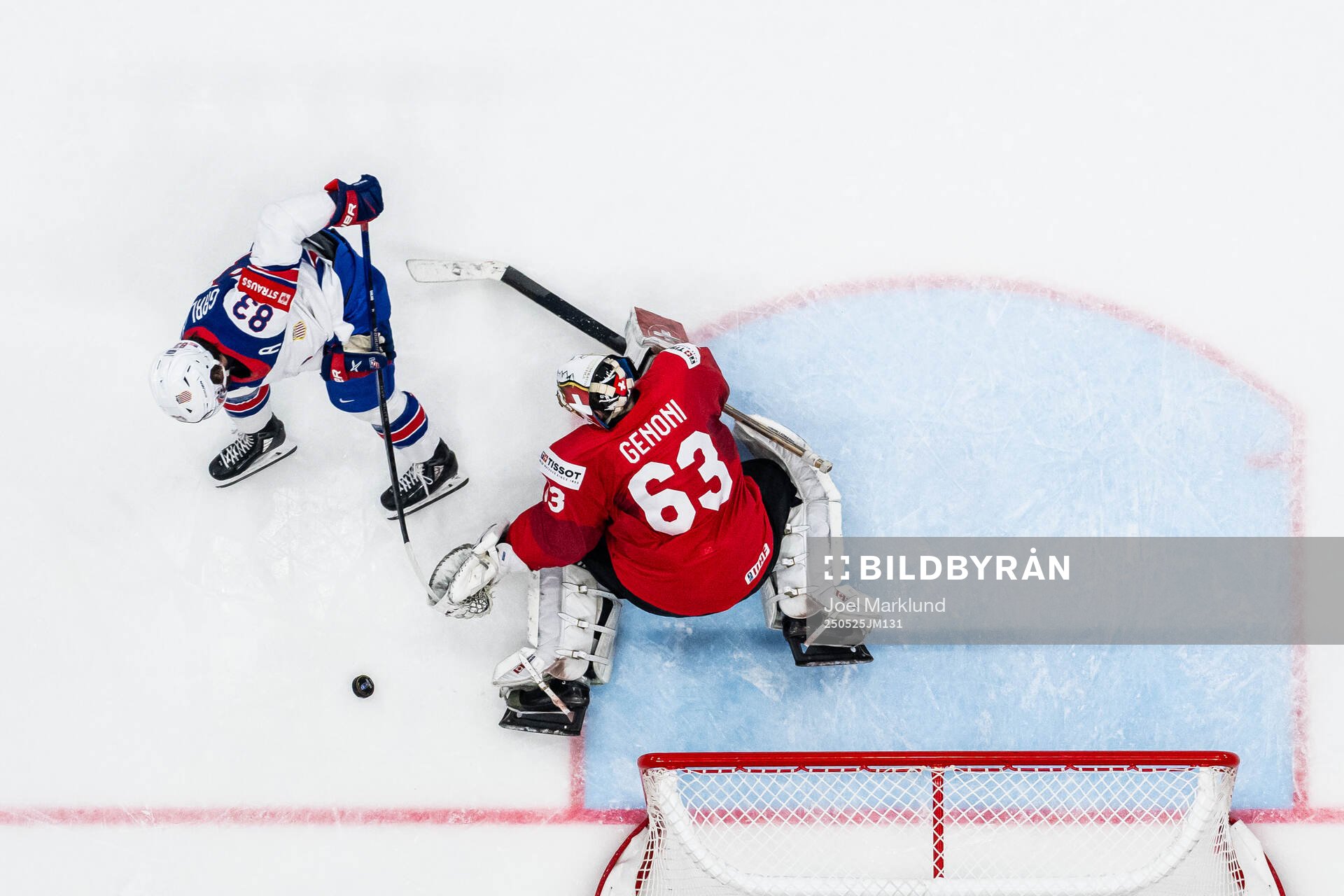 Goaltender Leonardo Genoni of Switzerland saves a penalty