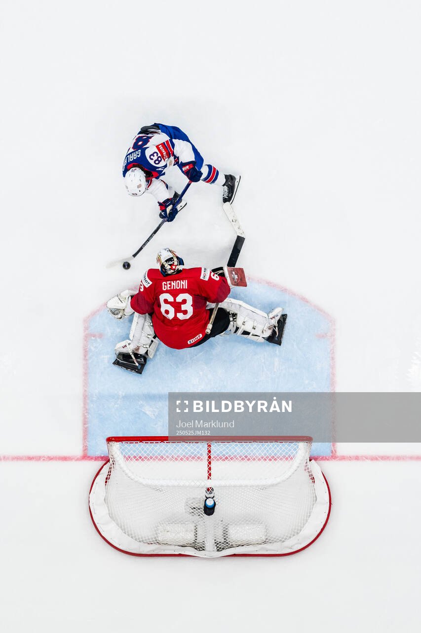 Goaltender Leonardo Genoni of Switzerland saves a penalty