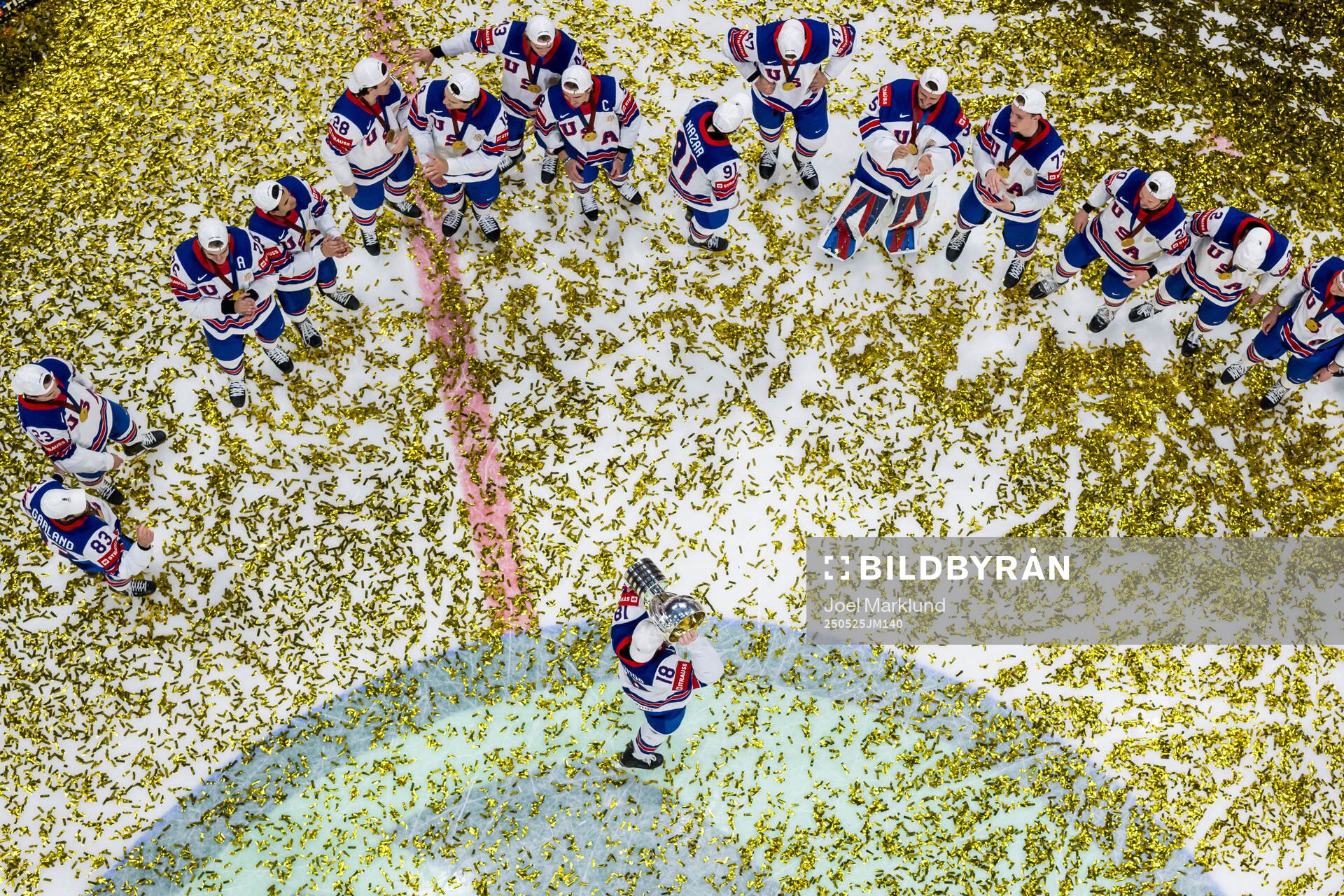Drew O'Connor of USA celebrates with the trophy in front of