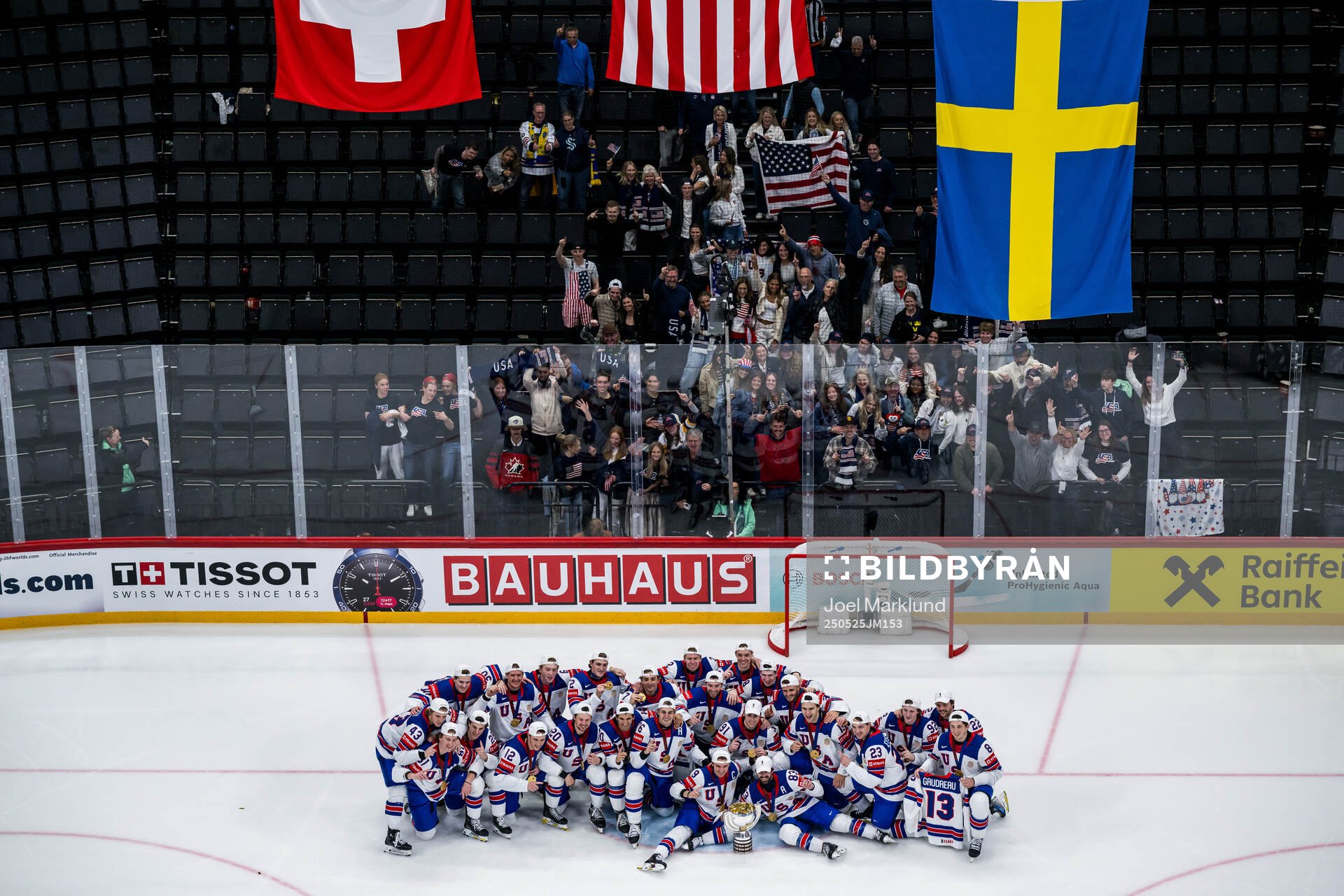 Players of USA celebrate with the trophy in front of team
