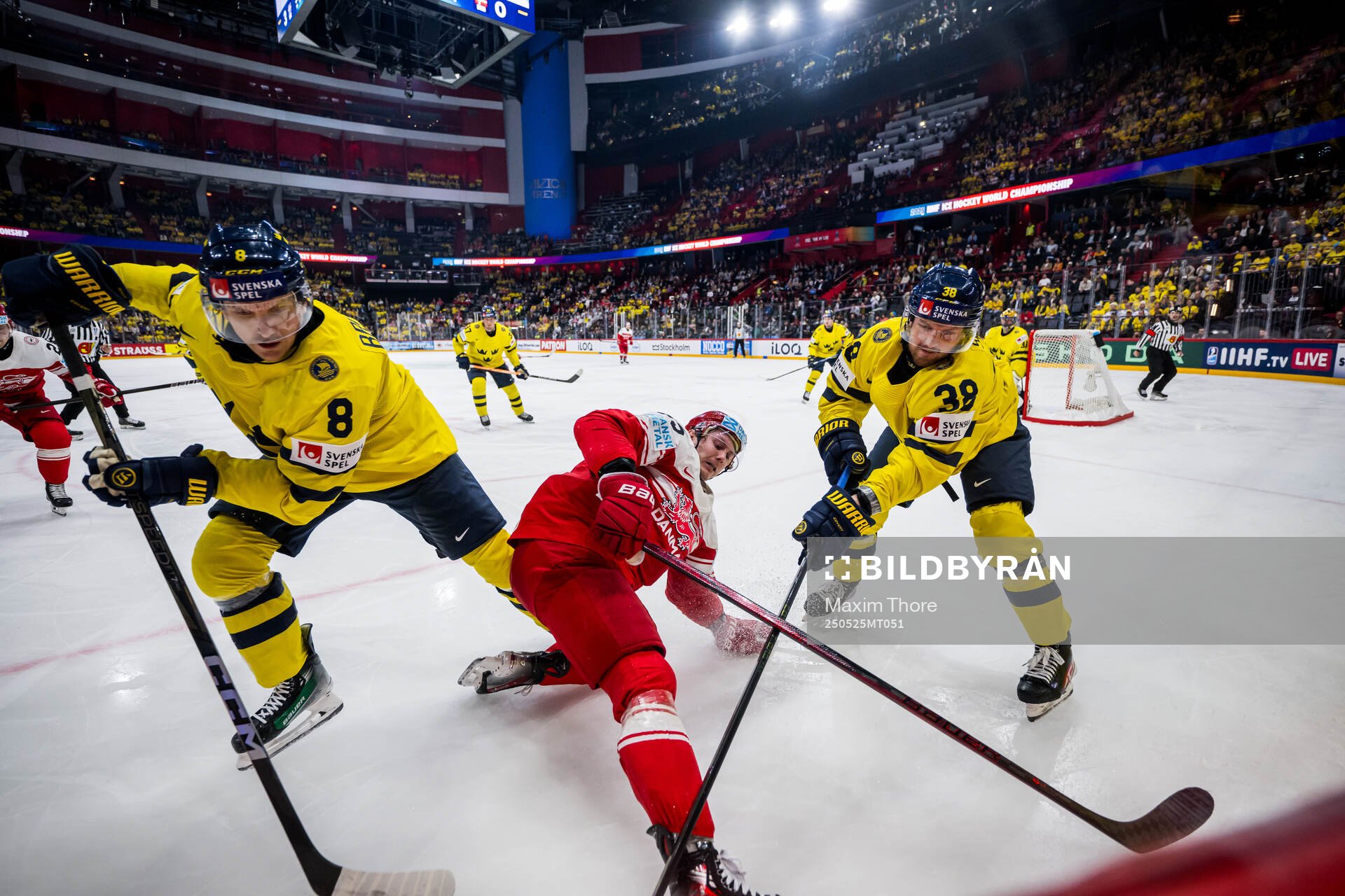 Nick Olesen of Denmark competes for the puck with Jonas
