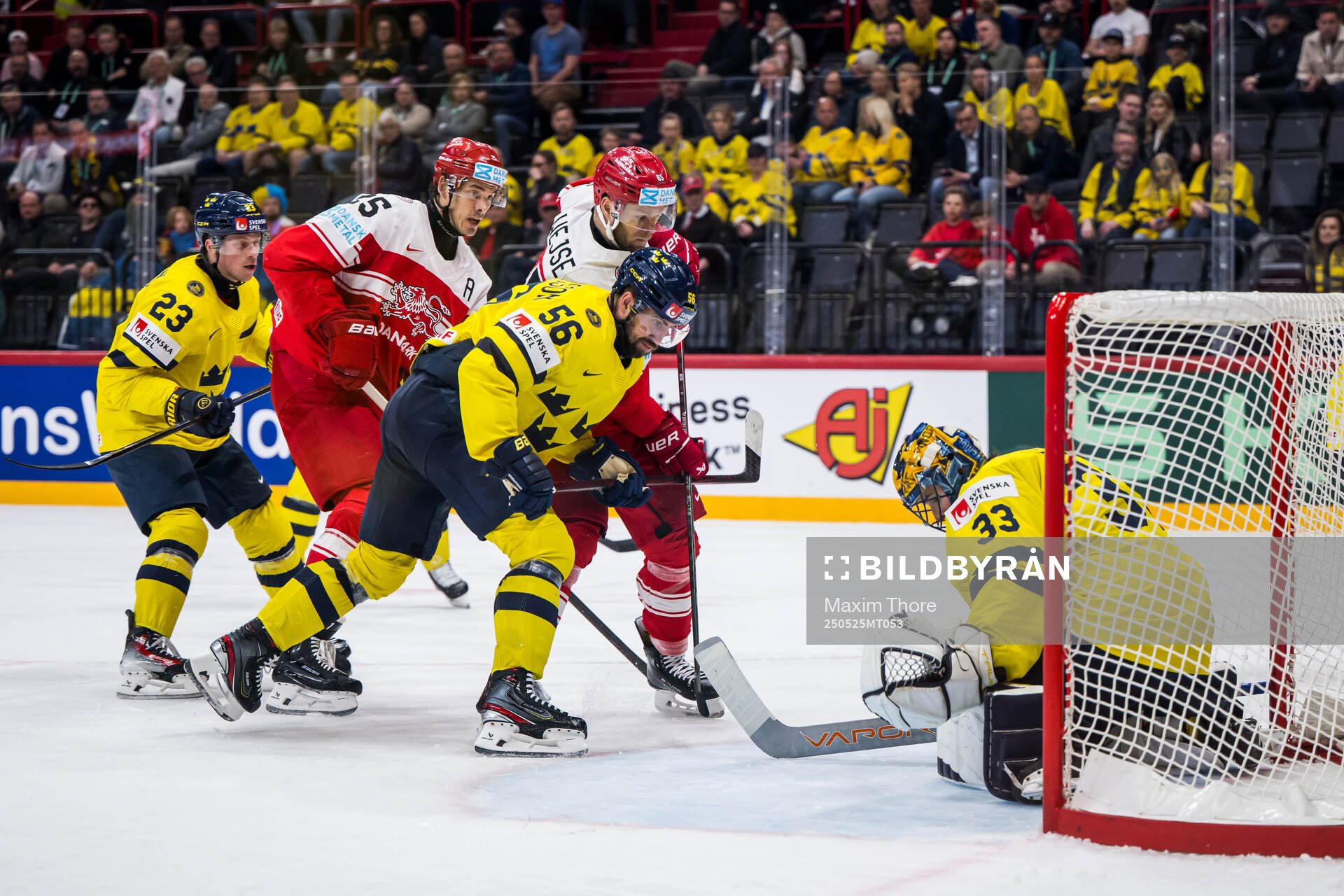 Christian Wejse of Denmark competes for the puck with Erik