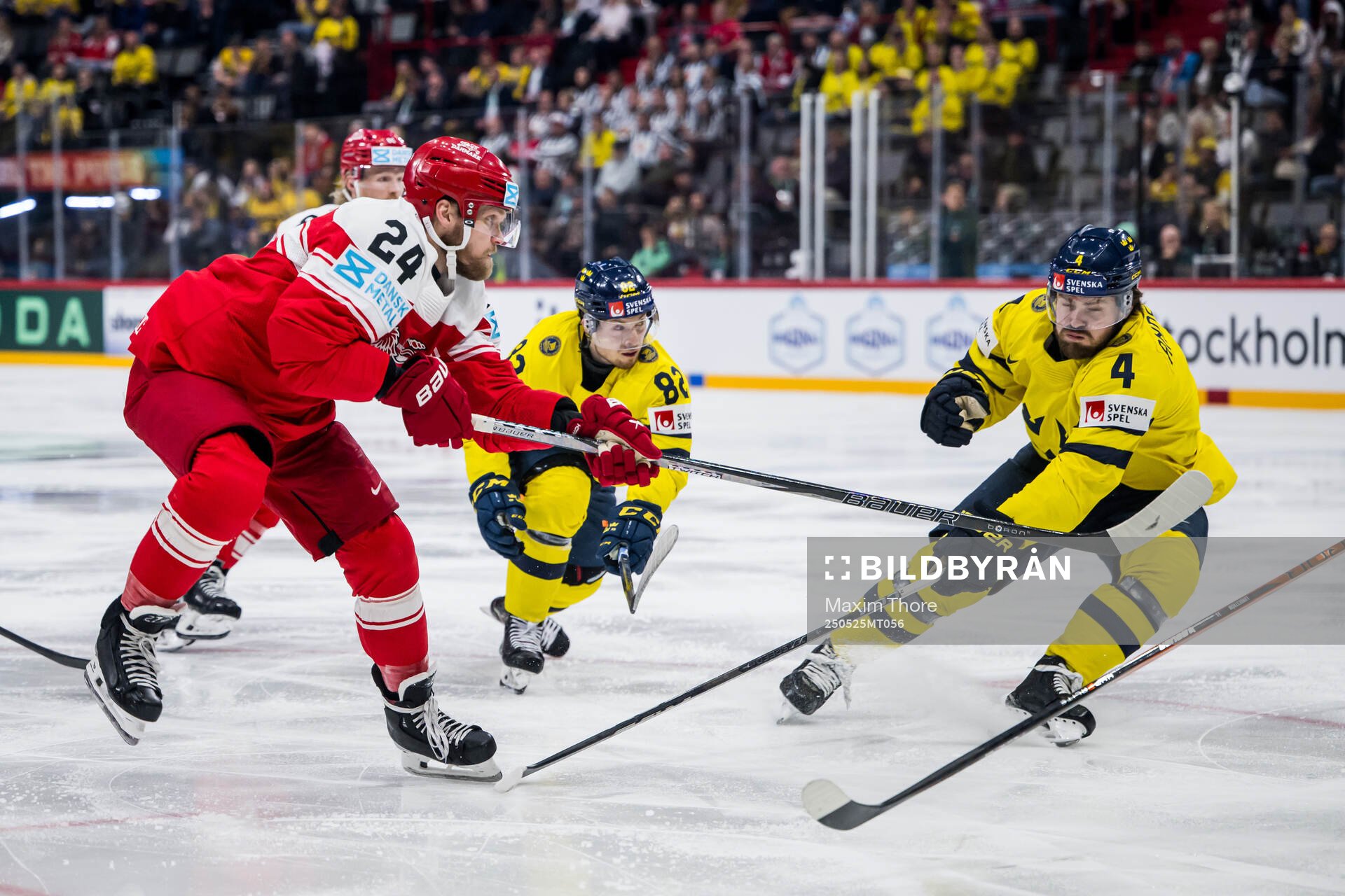 Nikolaj Ehlers of Denmark competes for the puck with Jesper