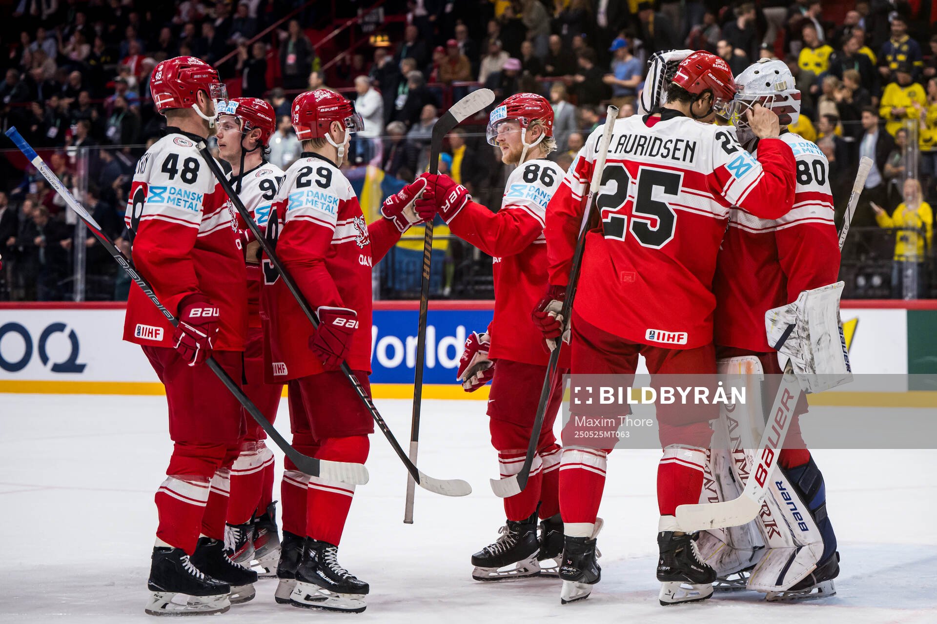 goaltender Frederik Dichow of Denmark looks dejected with
