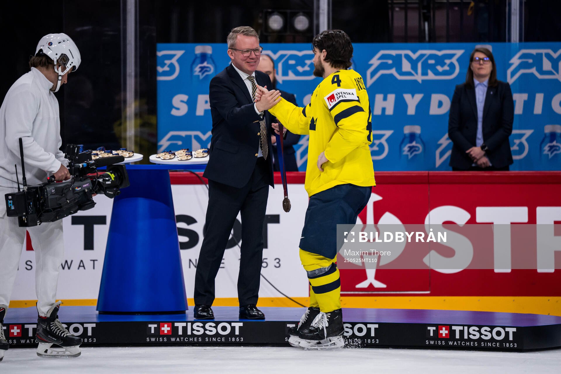 Rasmus Andersson of Sweden receives his bronze medal from