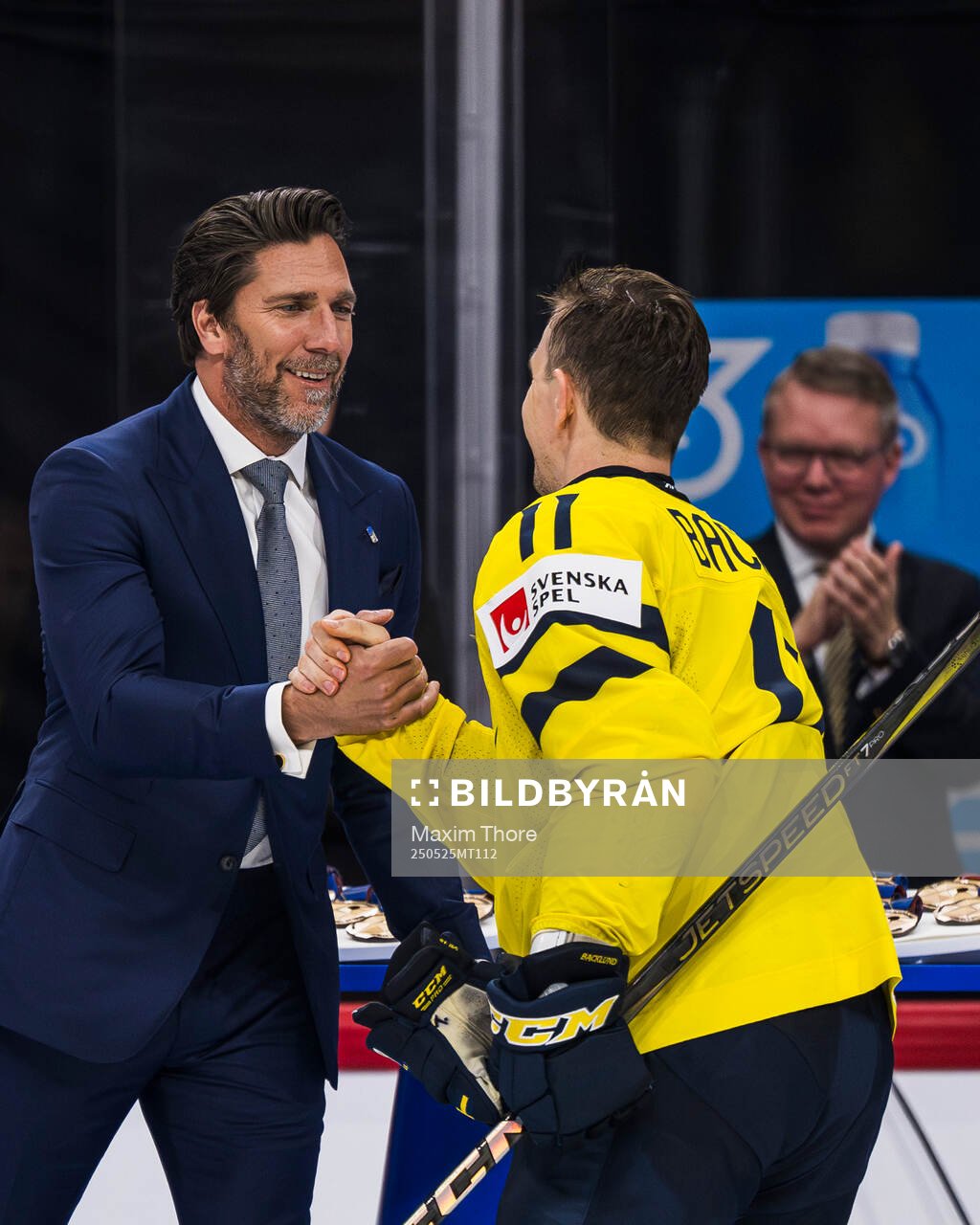 Henrik Lundqvist congratulates Mikael Backlund of Sweden