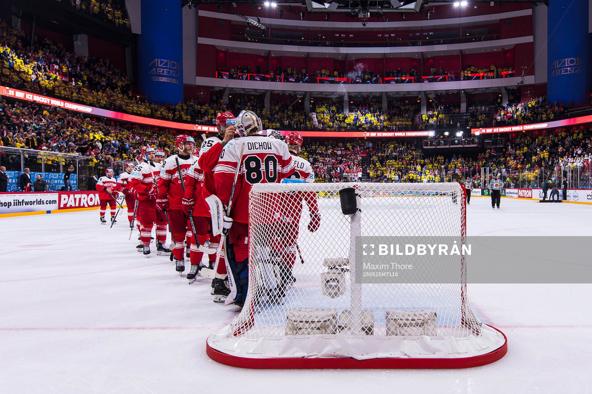 The players of Denmark thank goaltender Frederik Dichow