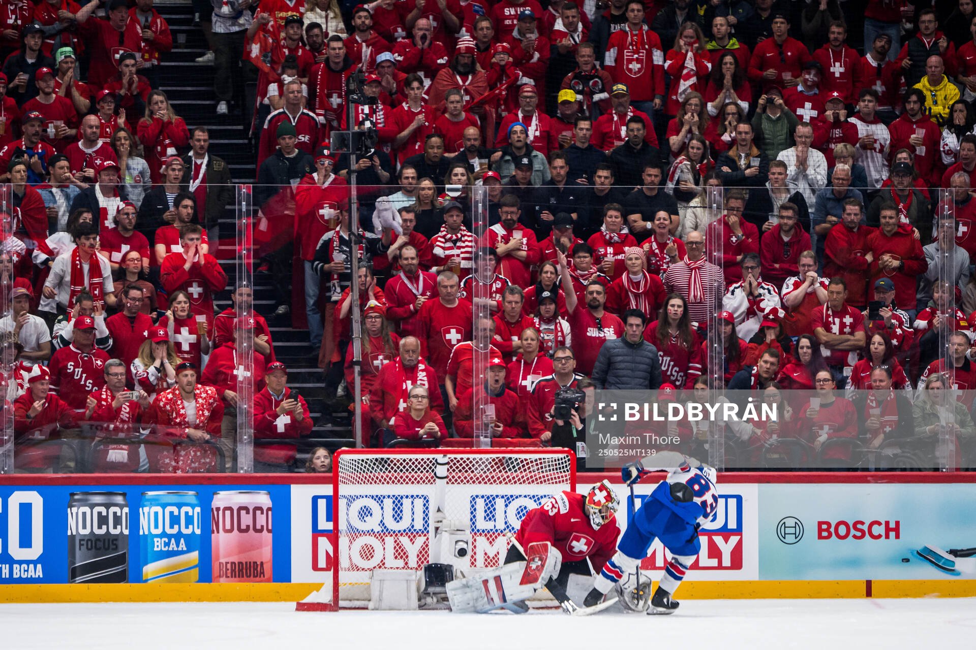 goaltender Leonardo Genoni of Switzerland saves a penalty