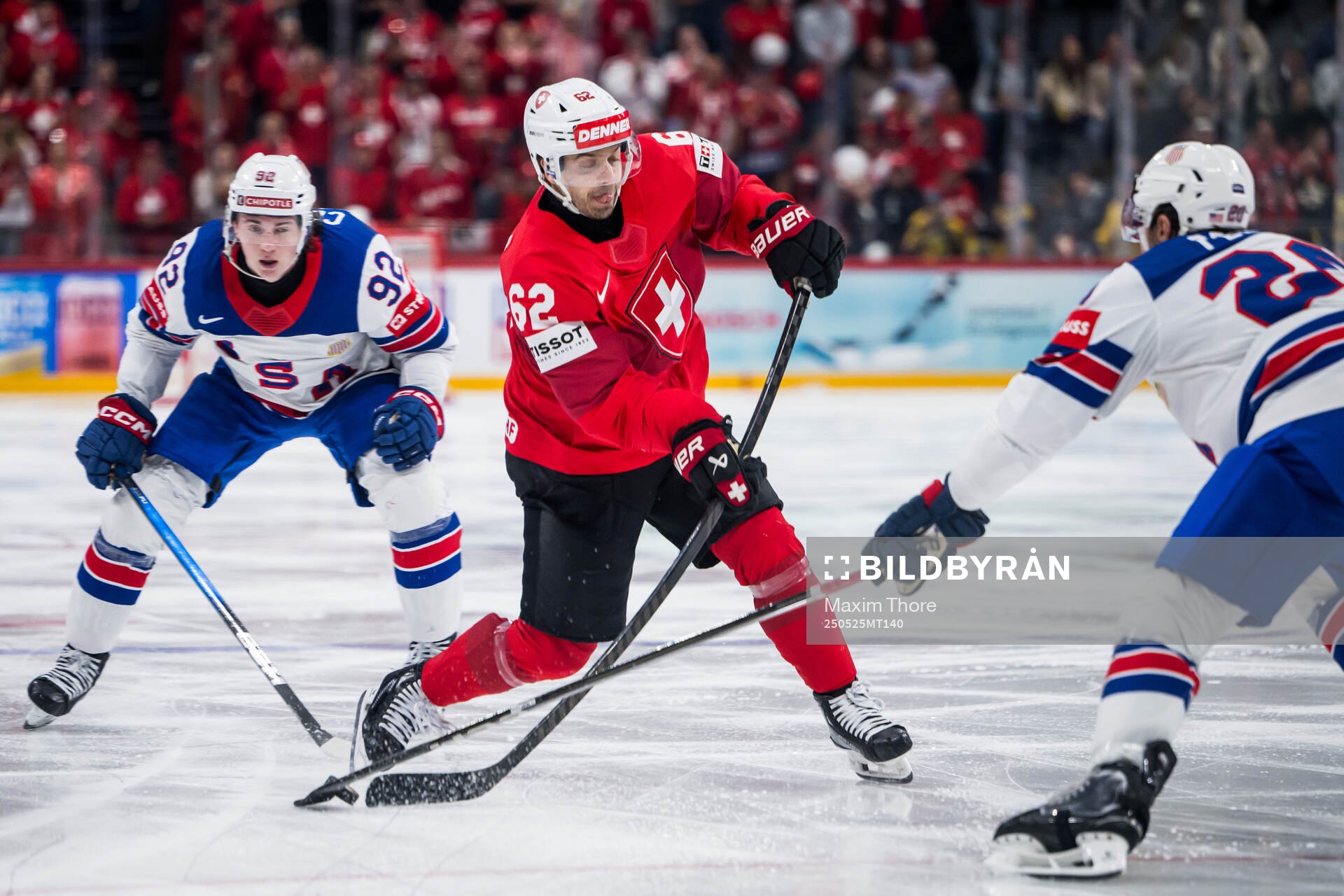 Logan Cooley of USA and Denis Malgin of Switzerland