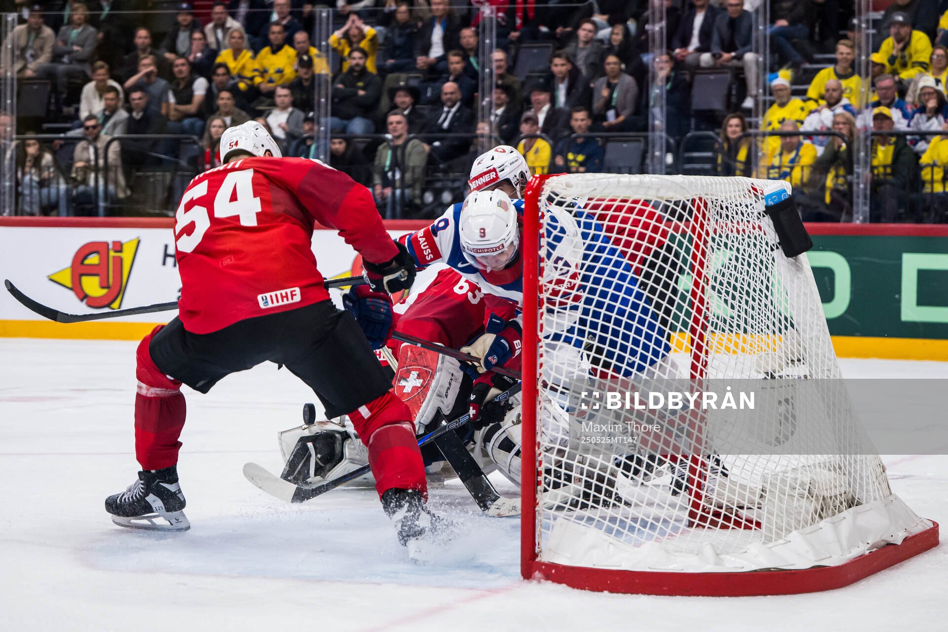 Clayton Keller of USA competes for the puck with Christian