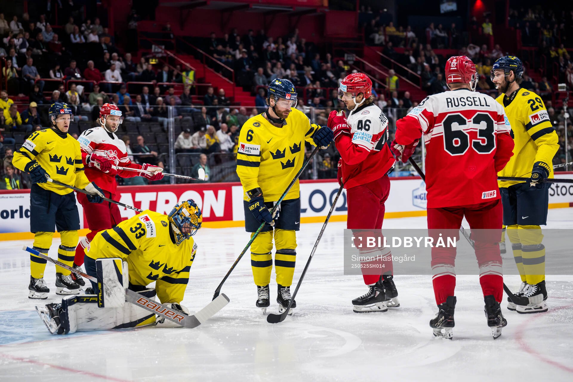 Goaltender Samuel Ersson and Adam Larsson with Jonas