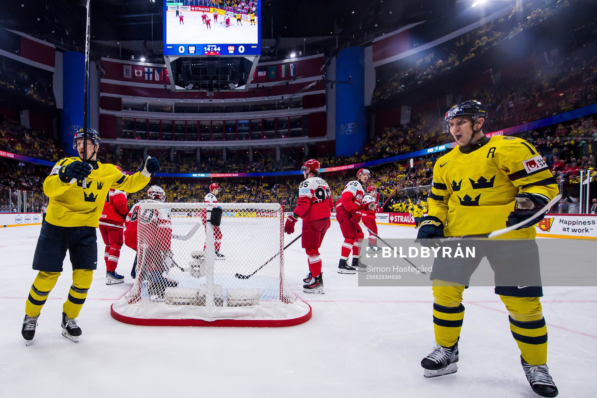 Emil Heineman and Mikael Backlund of Sweden celebrate the