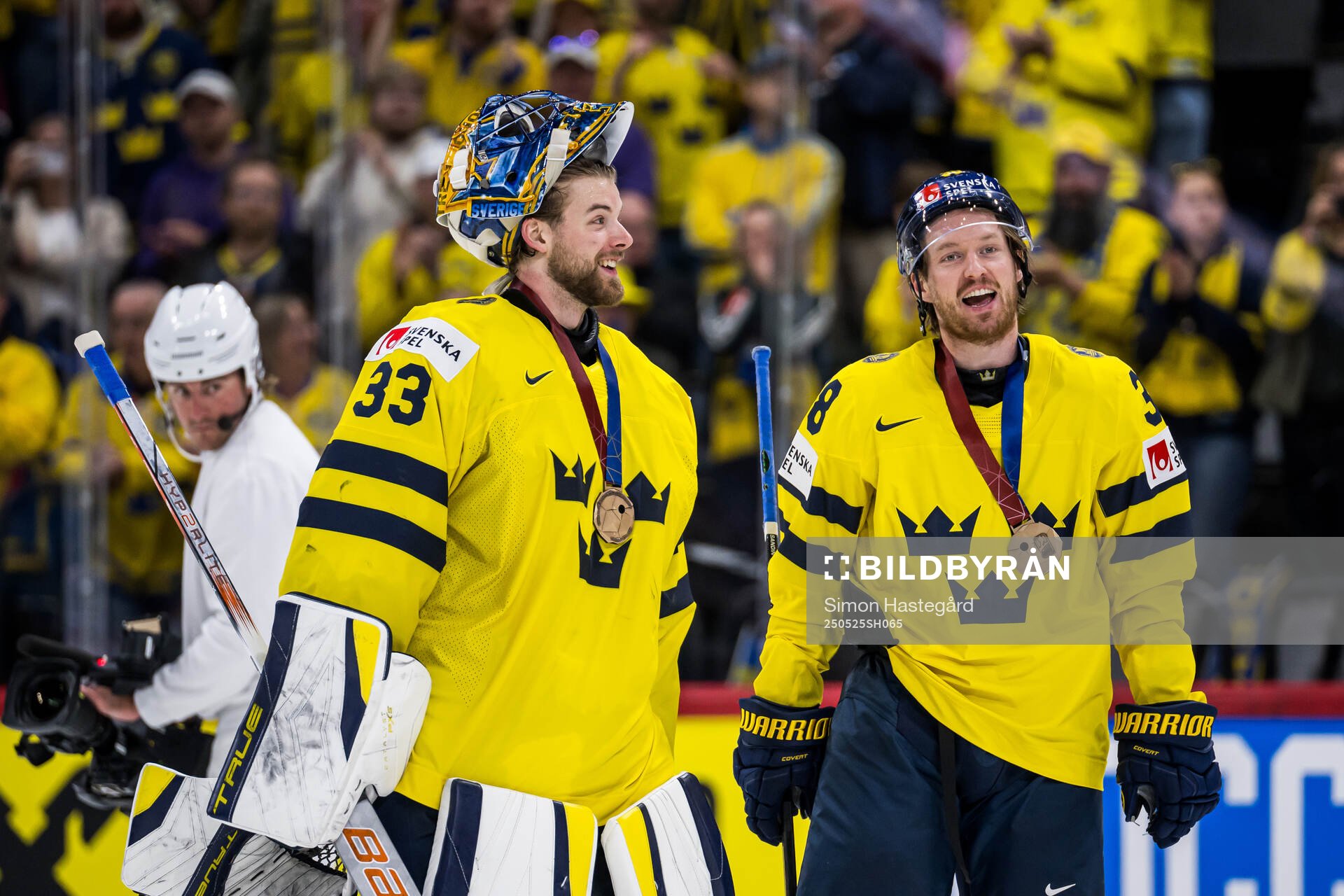 goaltender Samuel Ersson and Rasmus Sandin with their