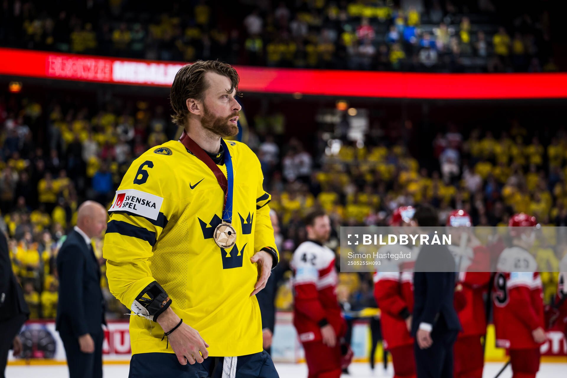 Adam Larsson  of Sweden with the bronze medal