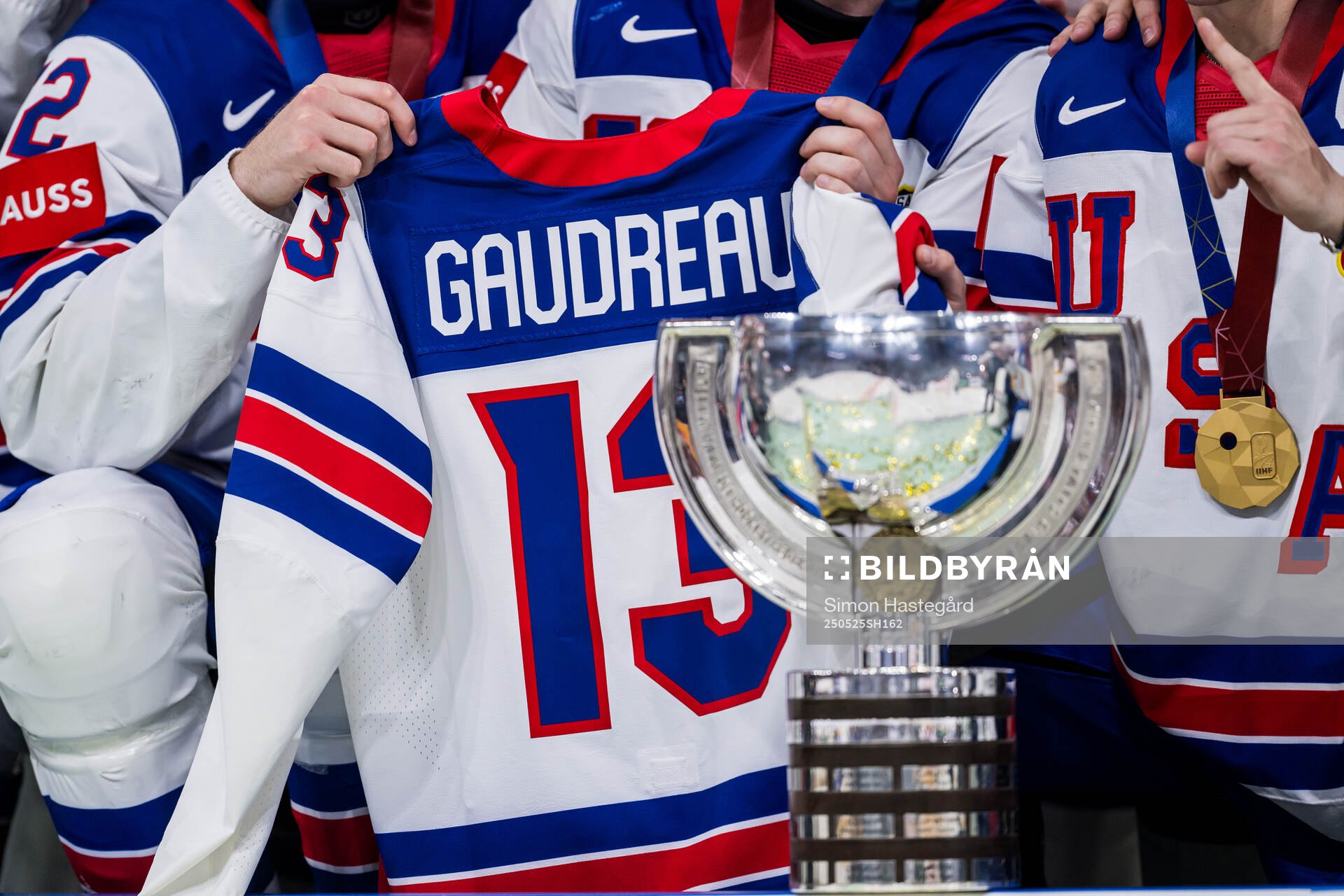The trophy is seen in front of the jersey of Johnny