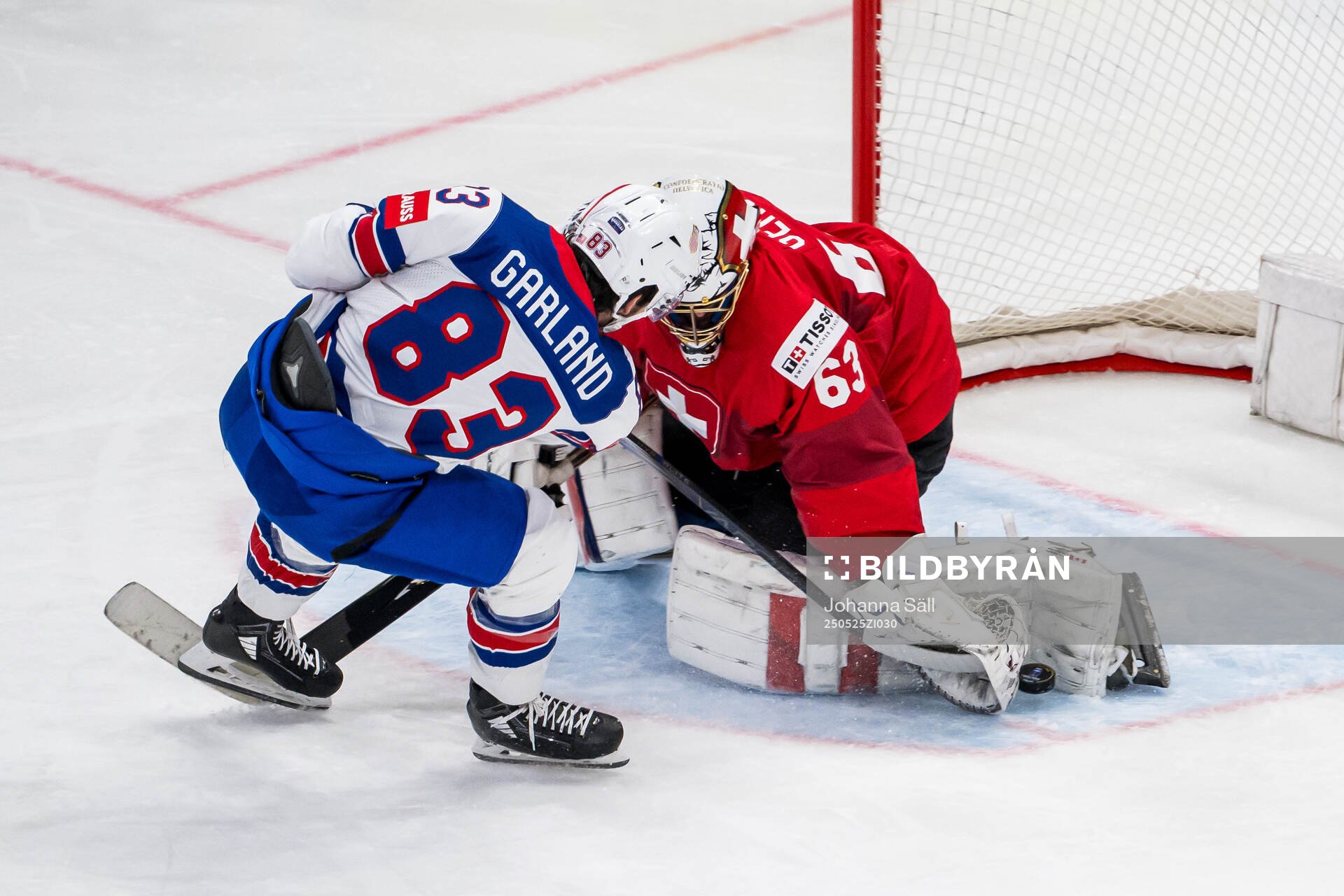 Goaltender Leonardo Genoni of Switzerland saves a penalty