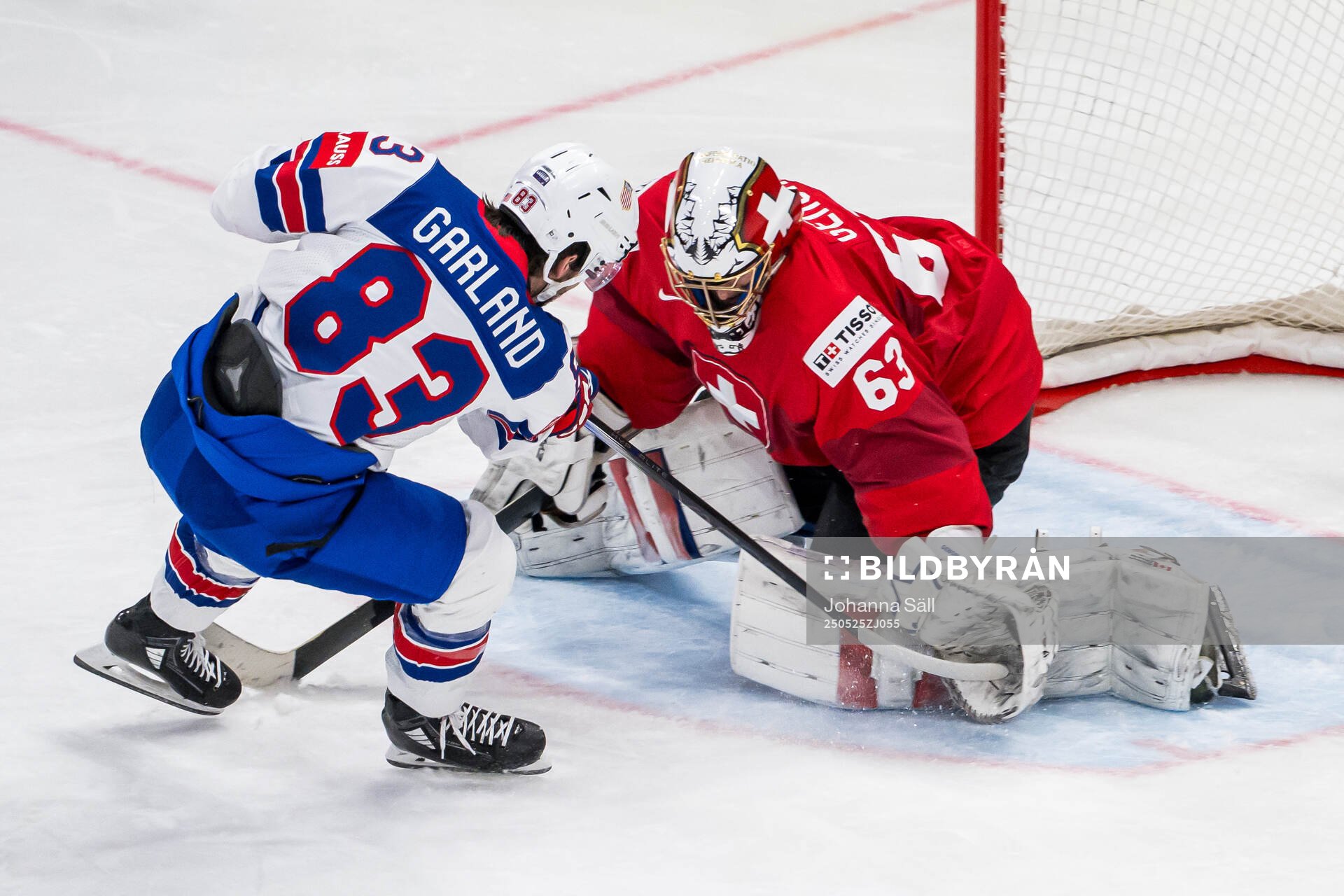 Goaltender Leonardo Genoni of Switzerland saves a penalty