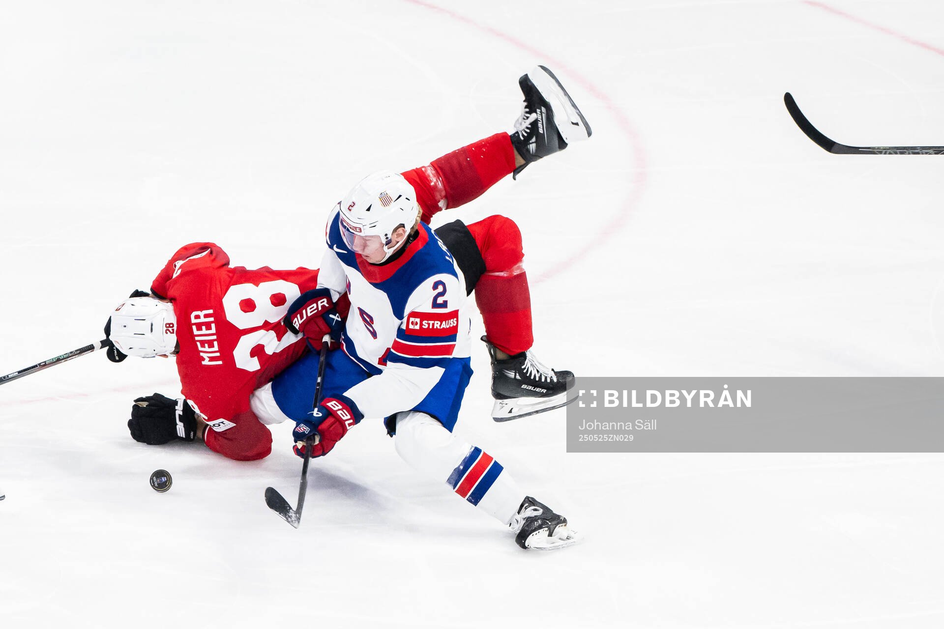 Timo Meier of Switzerland and Jackson LaCombe of USA