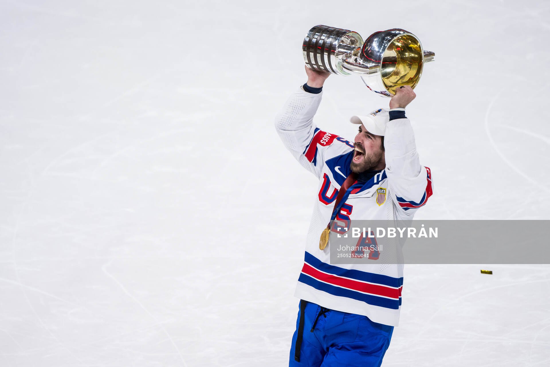 Zach Werenski of USA celebrates with the trophy