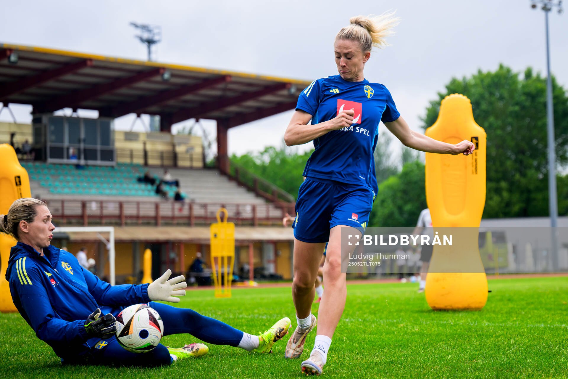 Fridolina Rolfö and goalkeeper Jennifer Falk of the