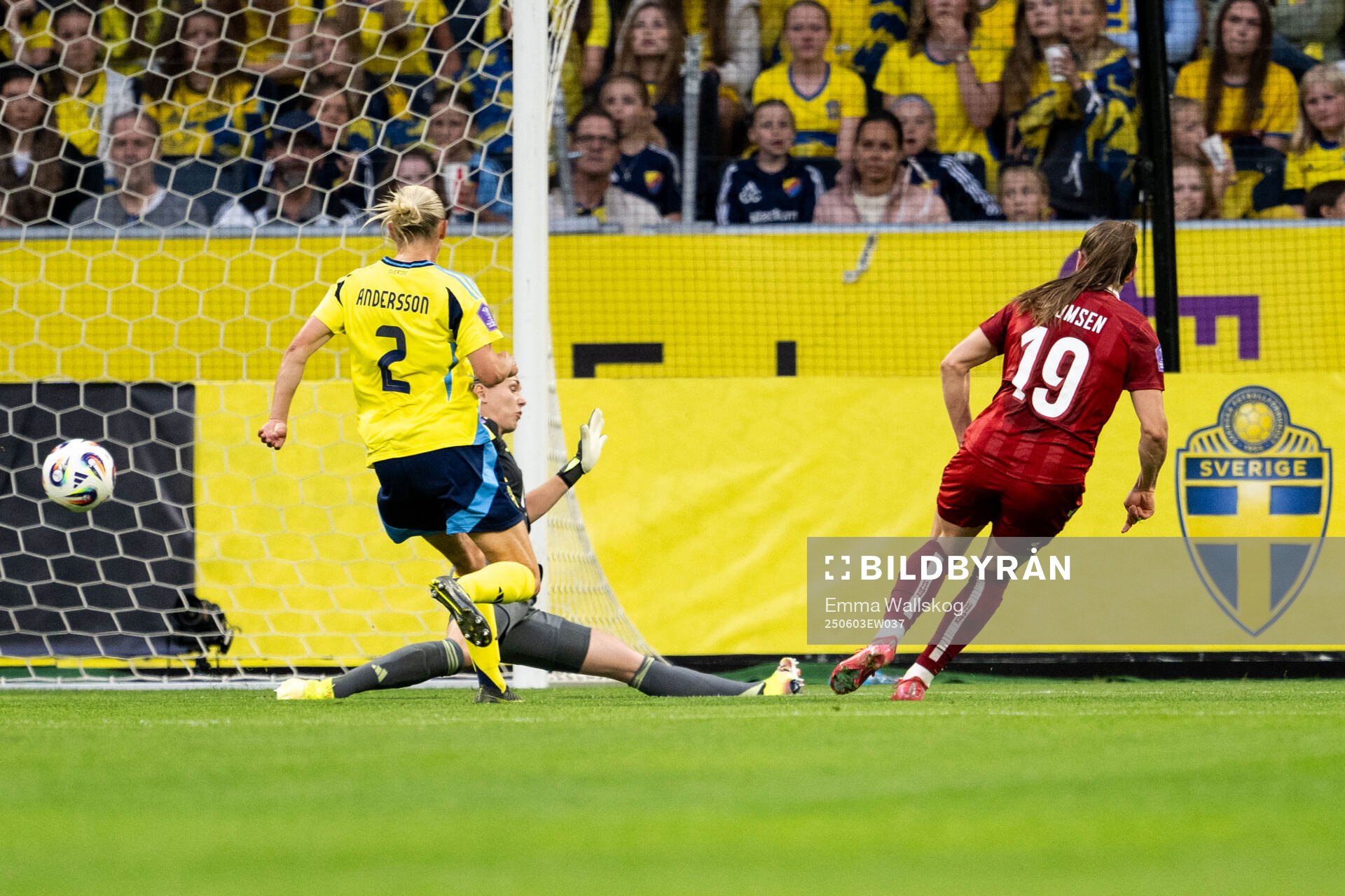 Janni Thomsen of Denmark scores 3-1 behind goalkeeper