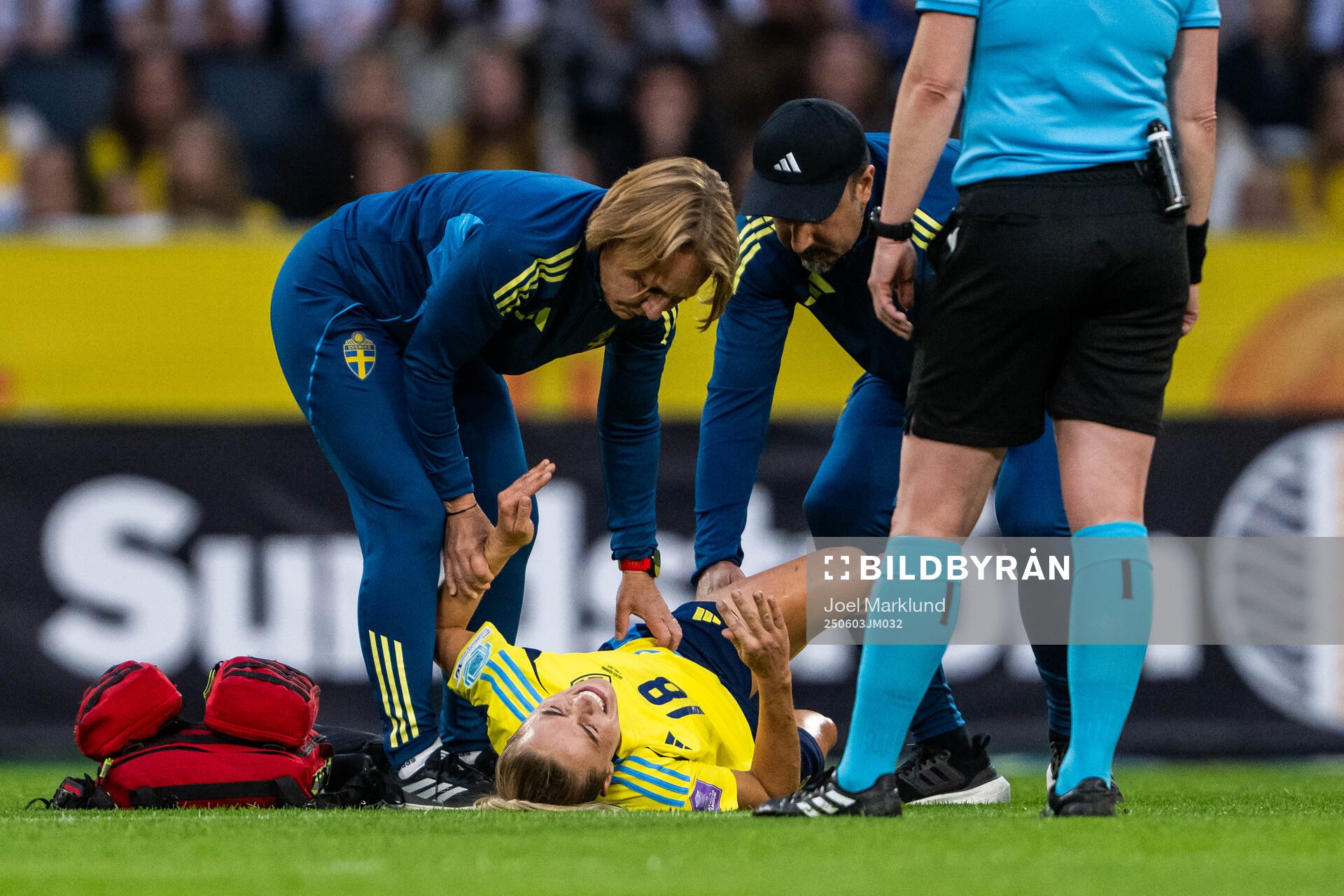 Fridolina Rolfö of Sweden receives medical attention