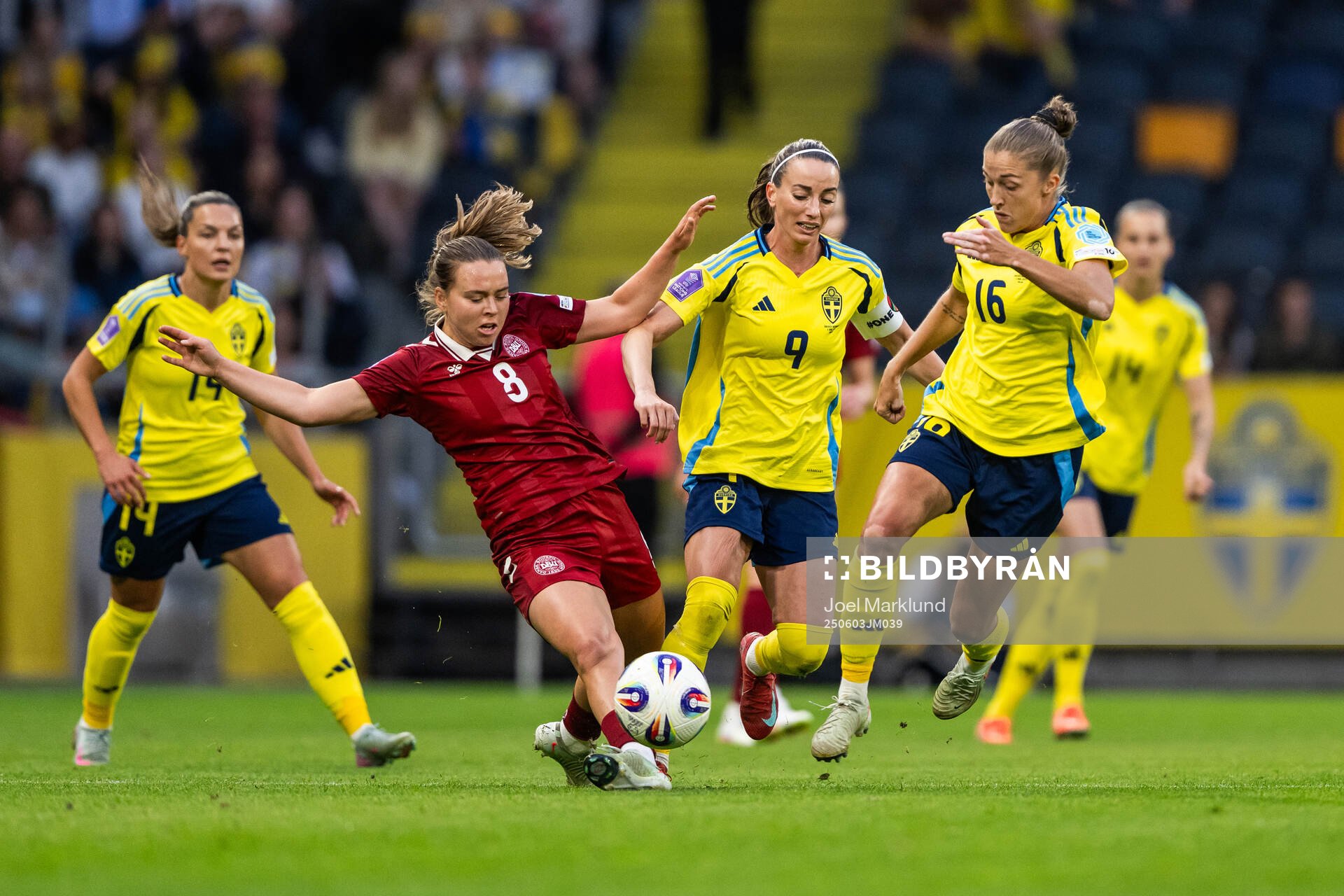 Emma Snerle of Denmark competes for the ball with Kosovare