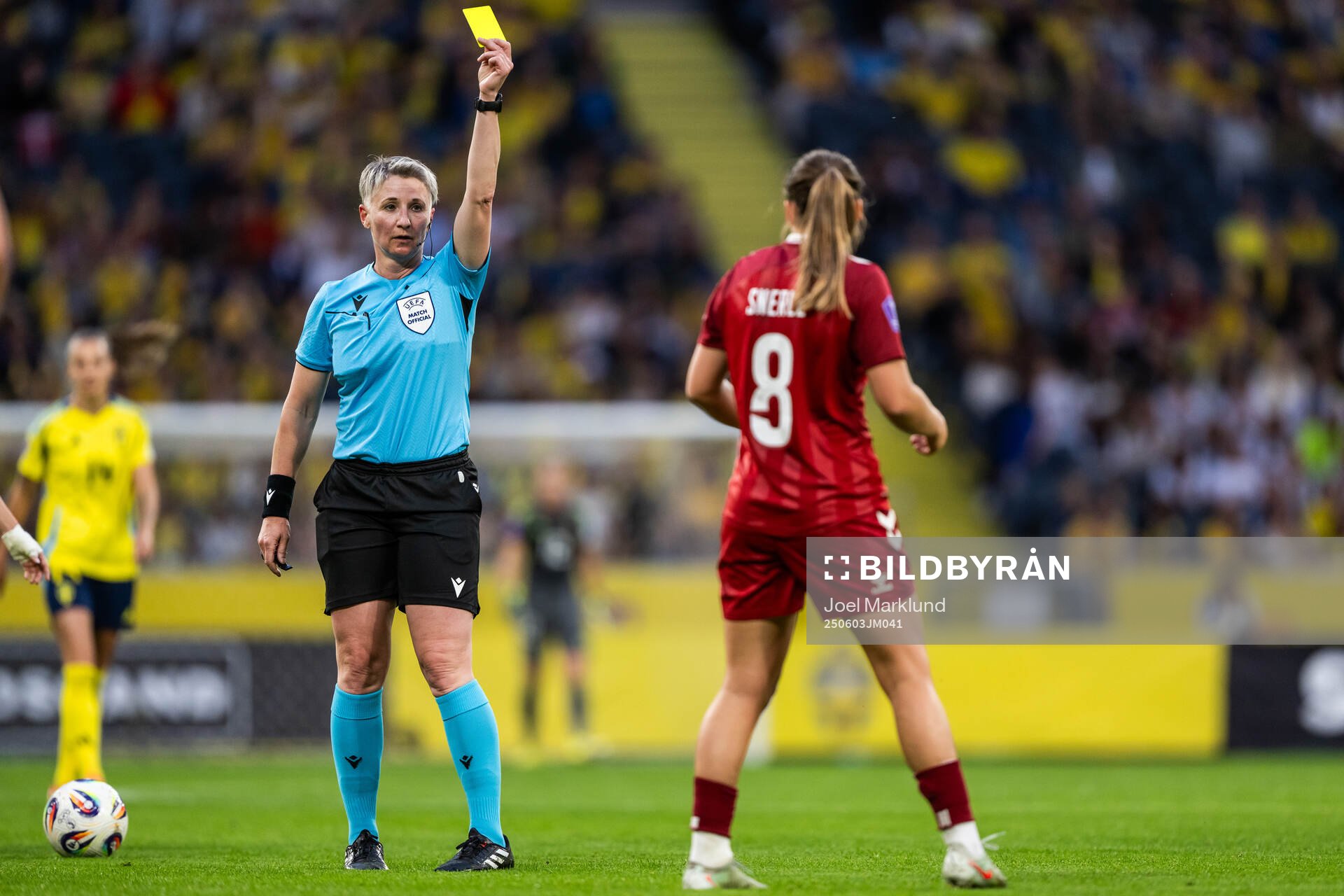 Emma Snerle of Denmark receives a yellow card from referee