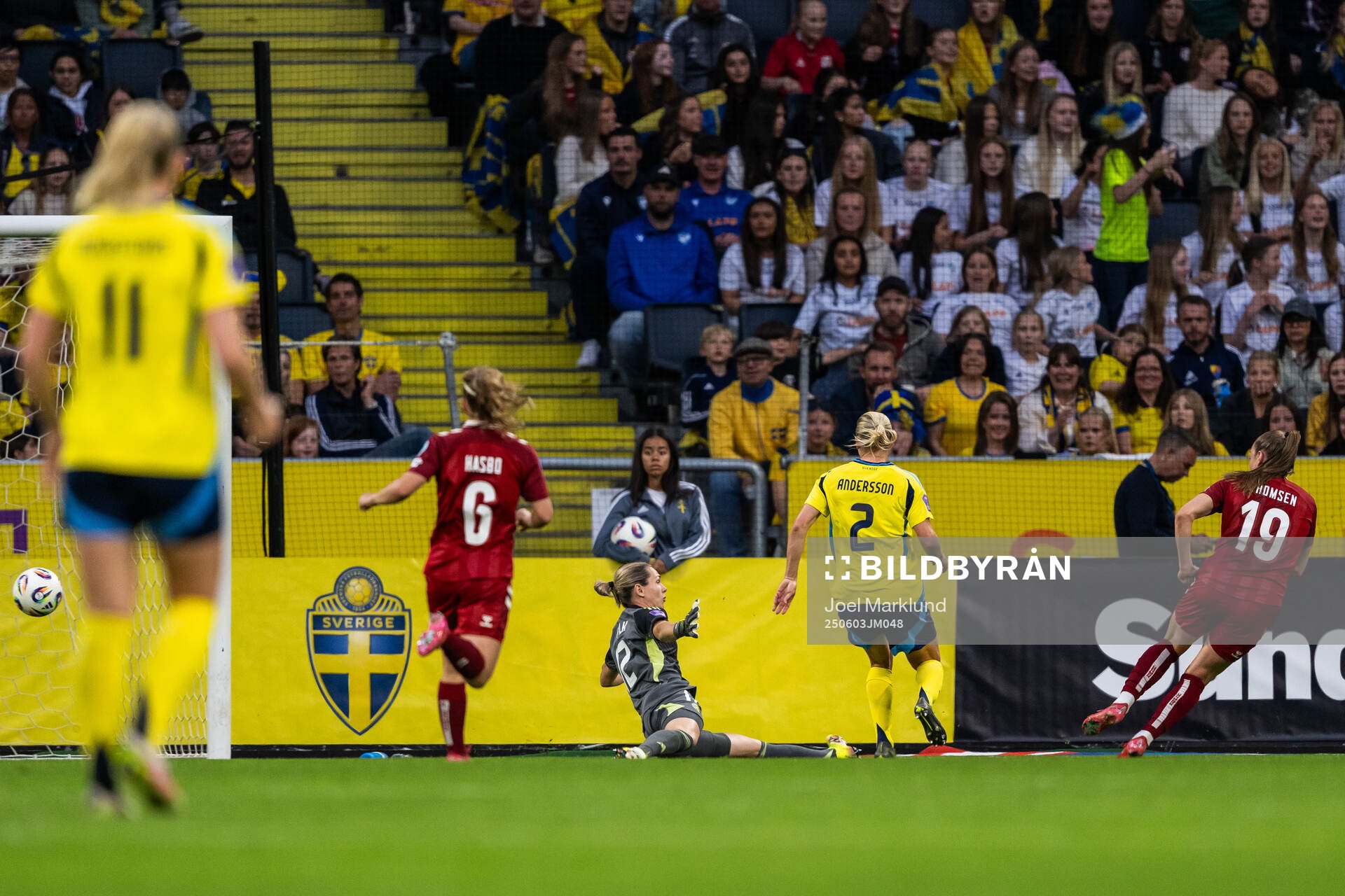 Janni Thomsen of Denmark scores 3-1 past goalkeeper