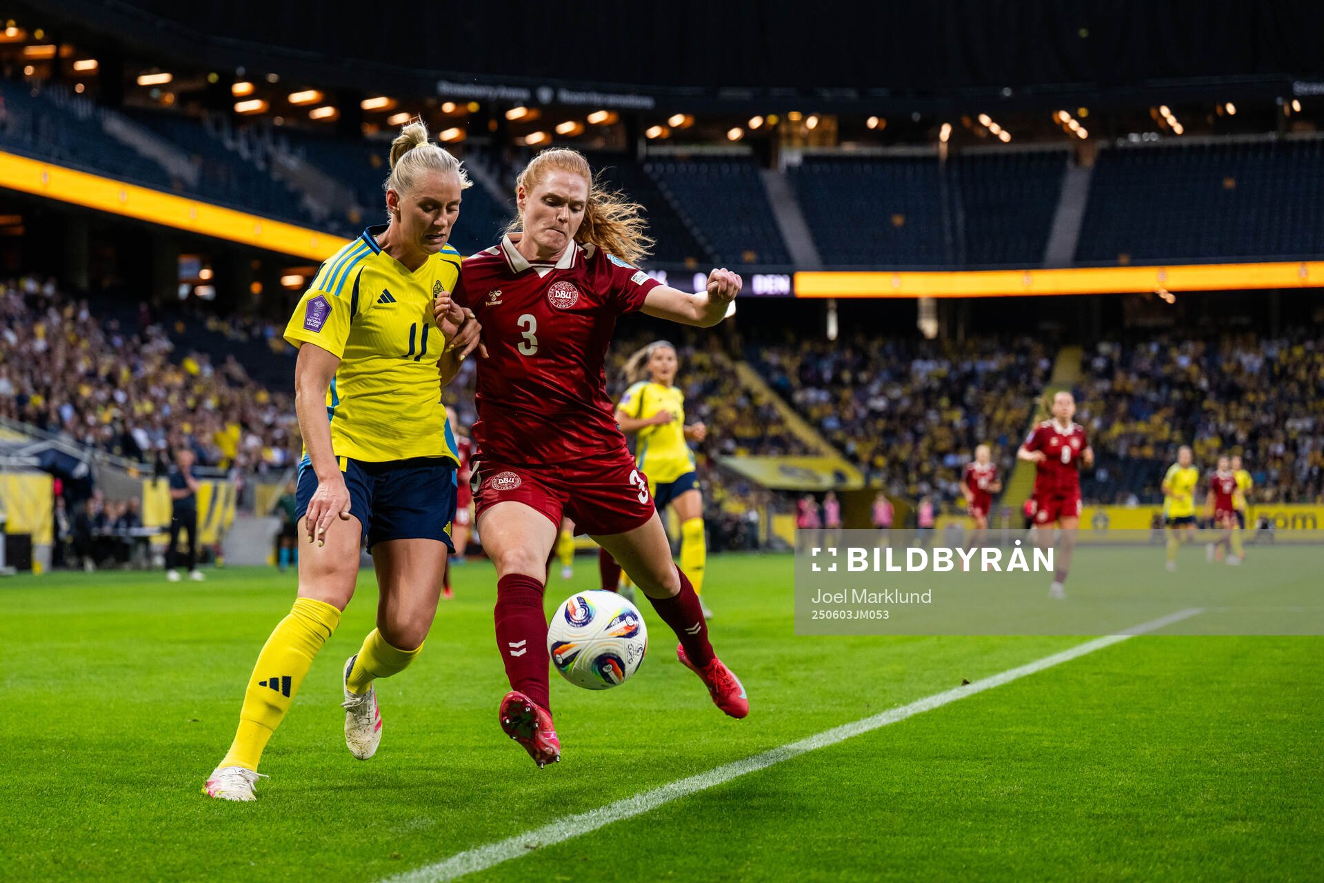Stina Blackstenius of Sweden and Stine Ballisager of Denmark