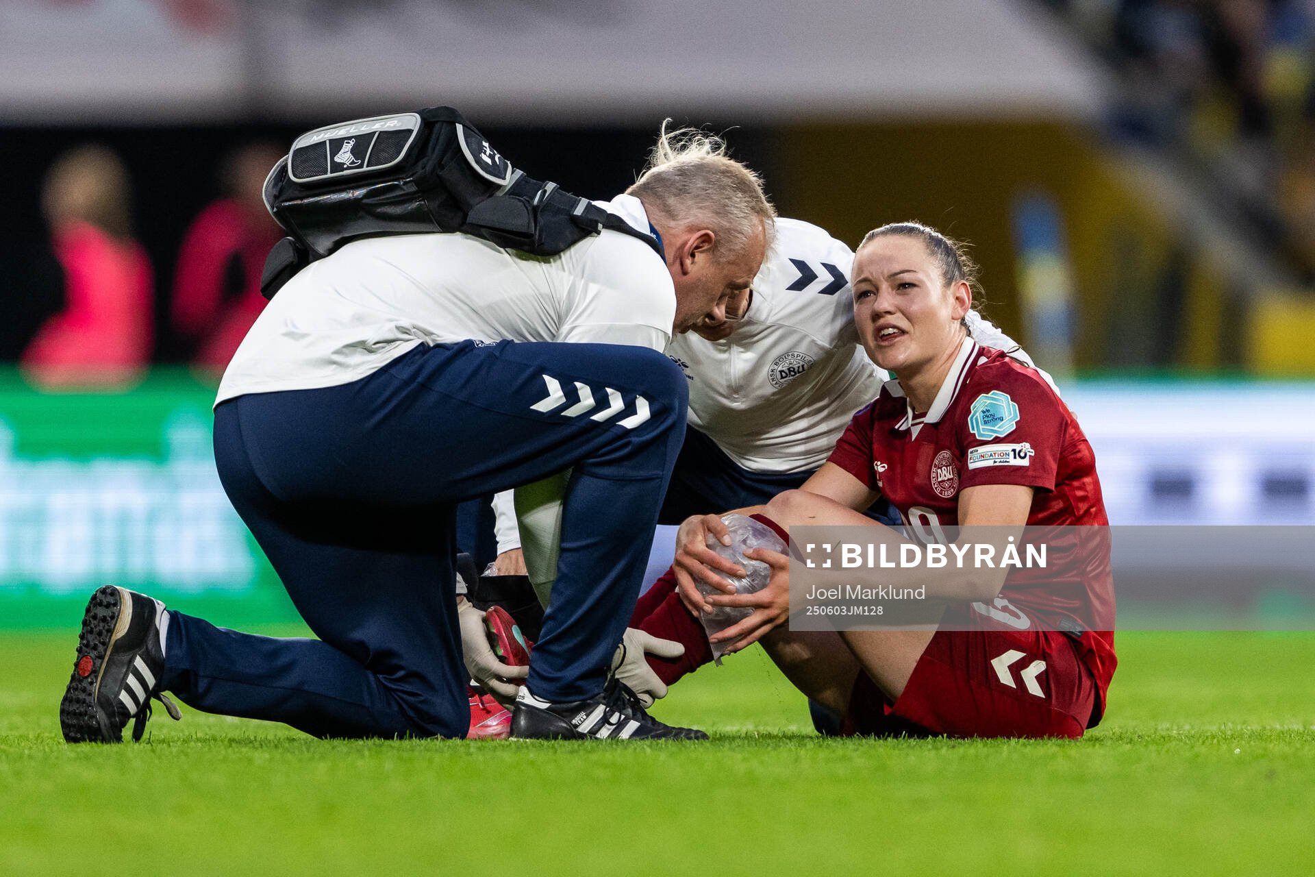 Janni Thomsen of Denmark receives medical attention