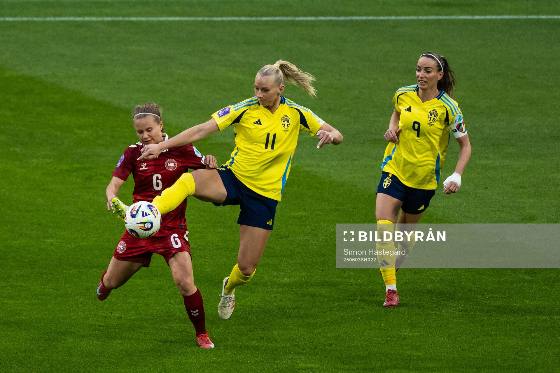 Josefine Hasbo of Denmark compete for the ball with Stina