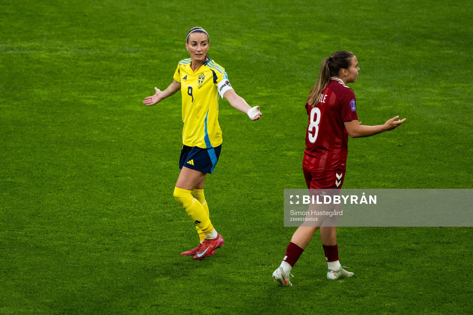 Kosovare Asllani of Sweden and Emma Snerle of Denmark react