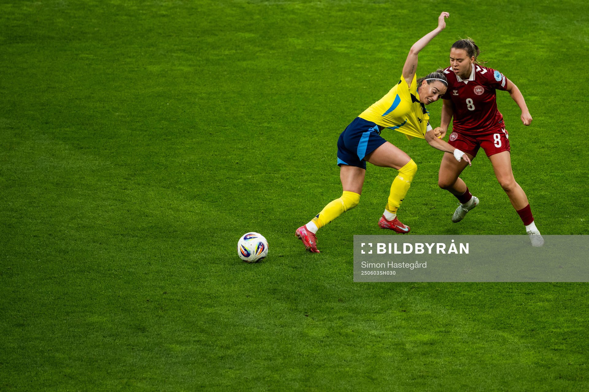 Kosovare Asllani of Sweden and Emma Snerle of Denmark