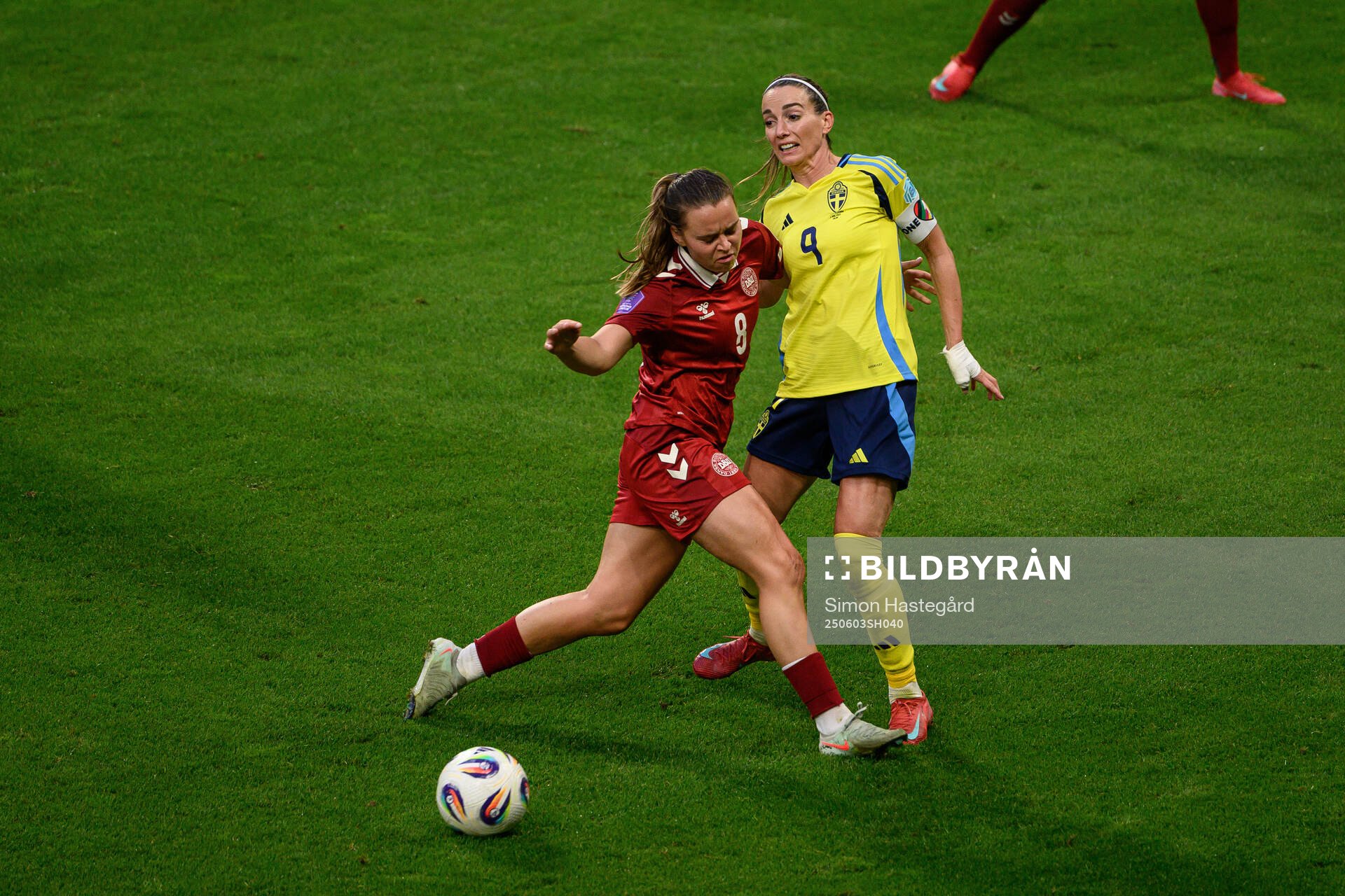 Emma Snerle of Denmark and Kosovare Asllani of Sweden