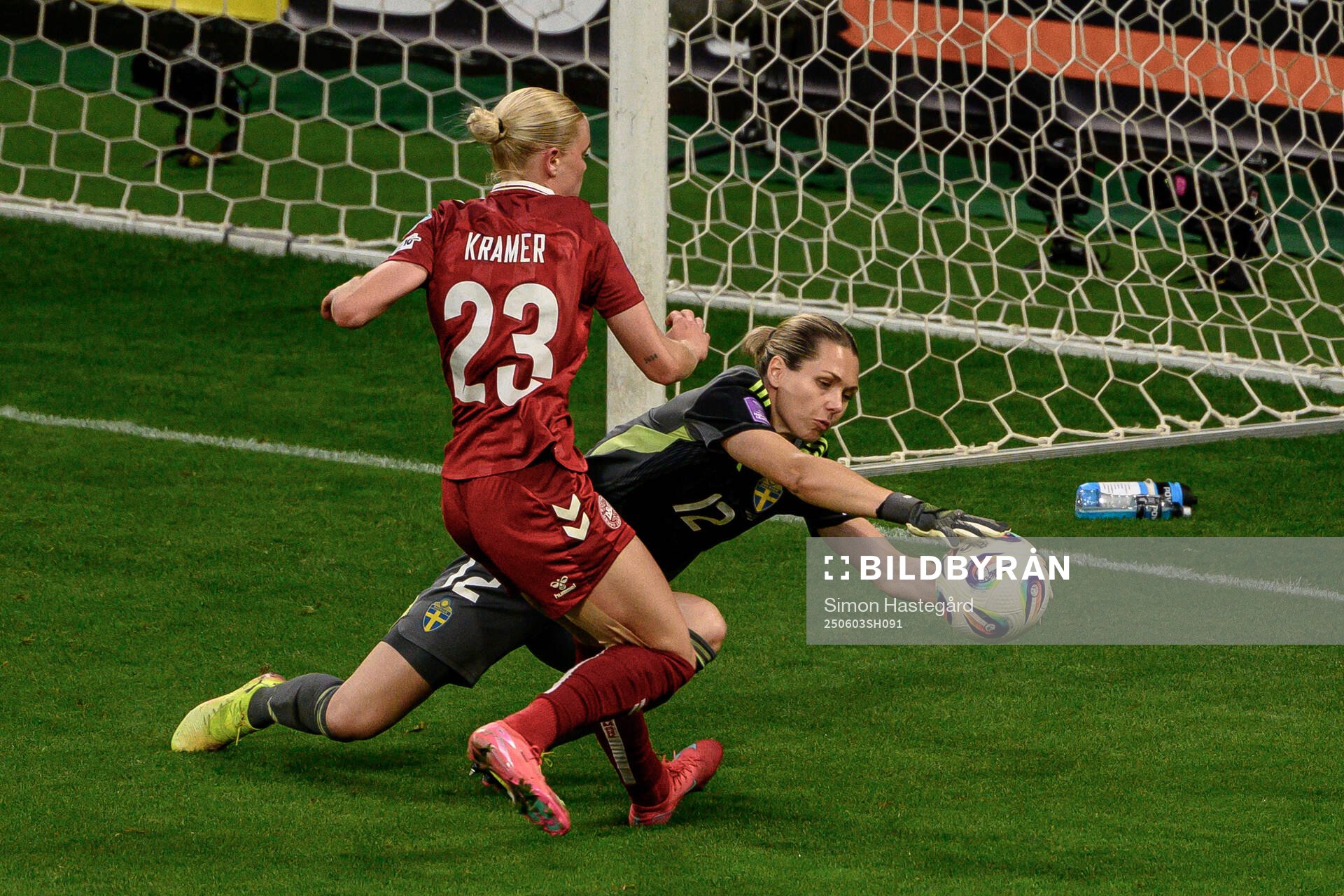 Cornelia Kramer of Denmark against goalkeeper Jennifer Falk