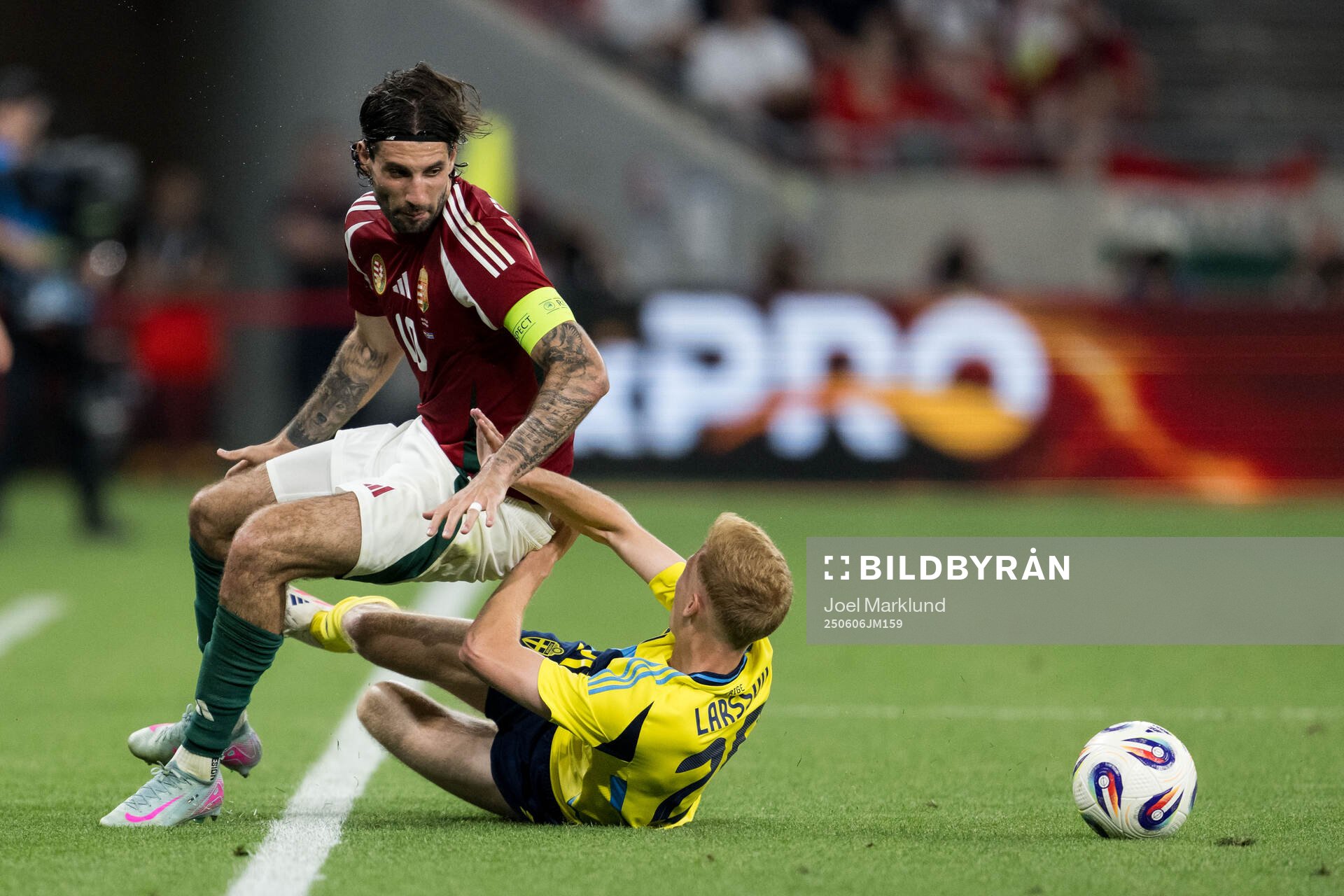 Dominik Szoboszlai of Hungary and Hugo Larsson of Sweden