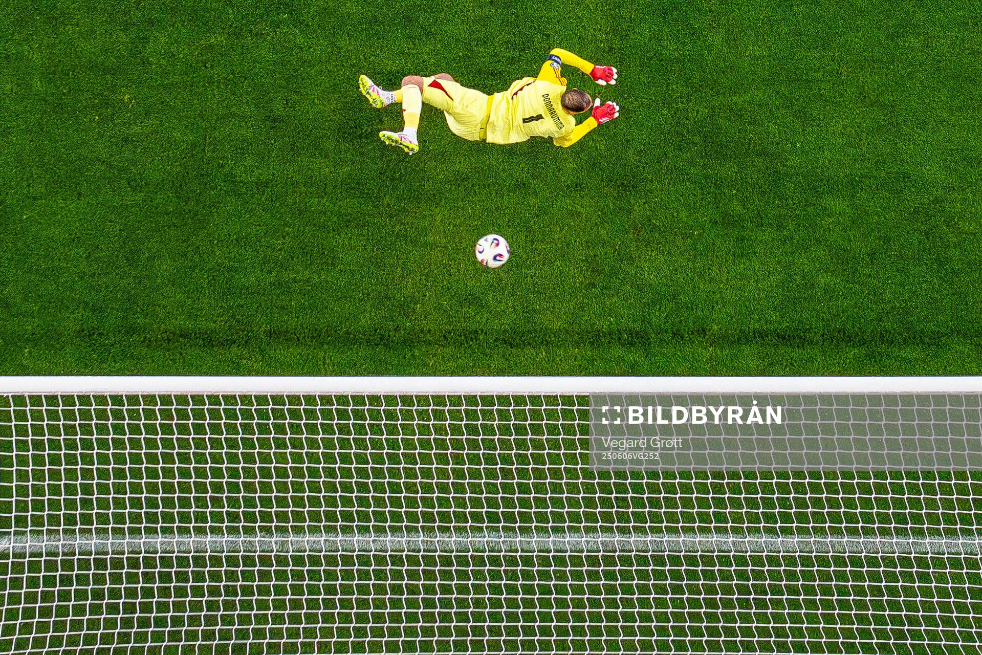 Goalkeeper Gianluigi Donnarumma of Italy as the ball hits