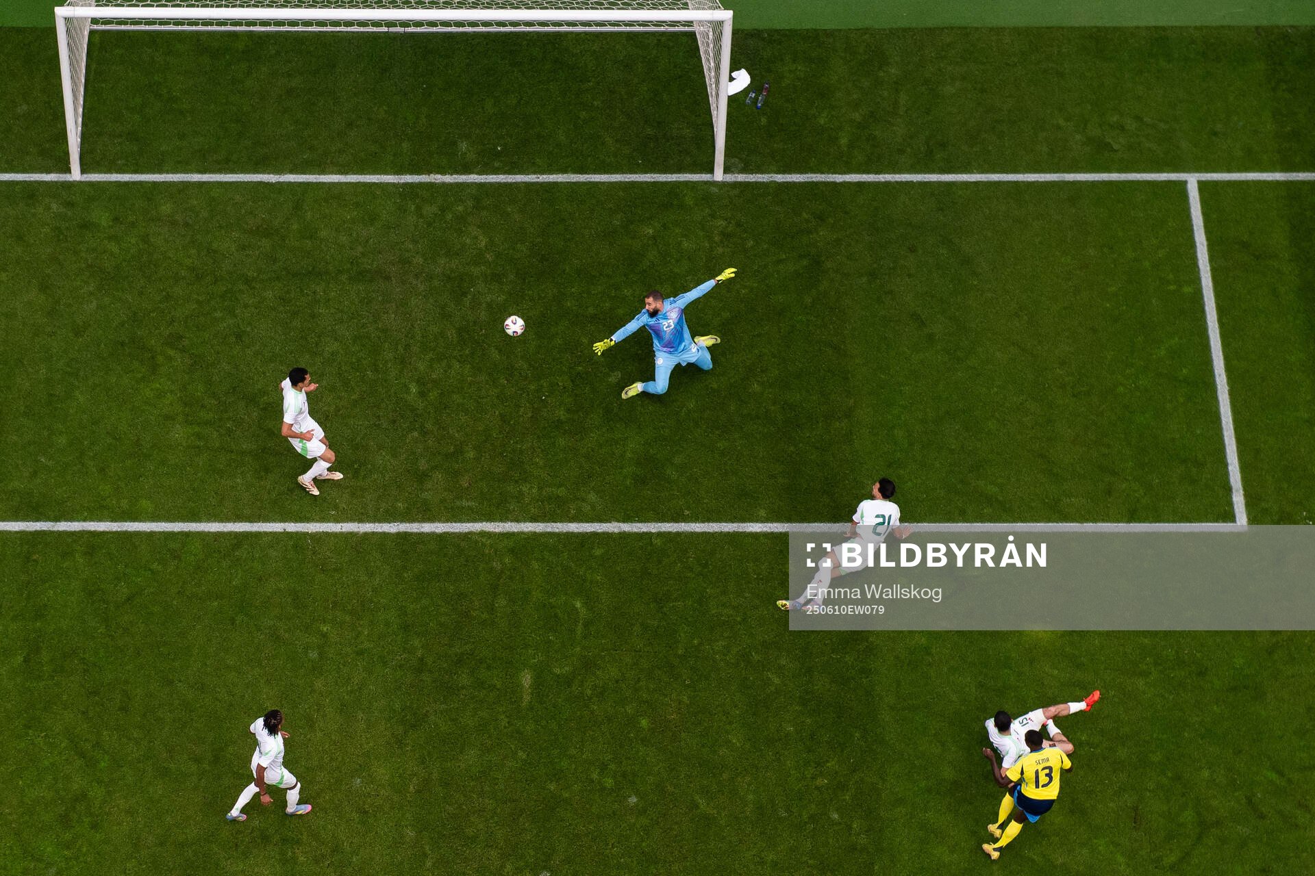 Ken Sema of Sweden scores 1-0 behind goalkeeper Anthony
