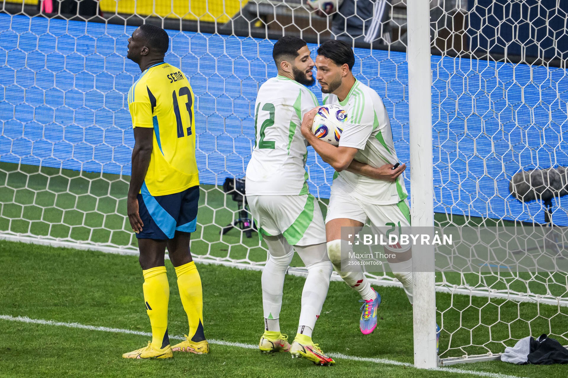 Yassine Benzia and Ramy Bensebaini of Algeria celebrate the
