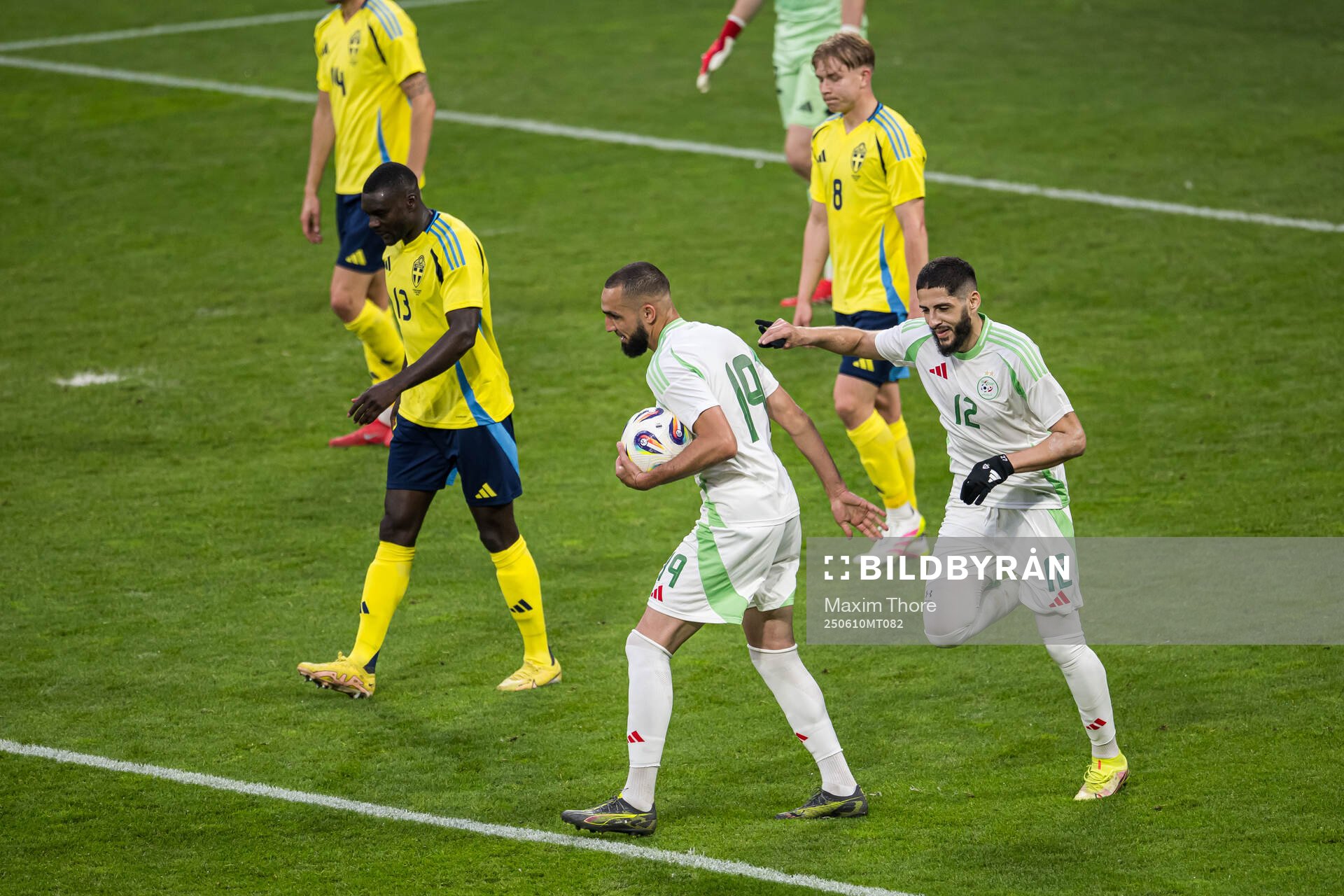 Nabil Bentaleb and Yassine Benzia of Algeria celebrate the
