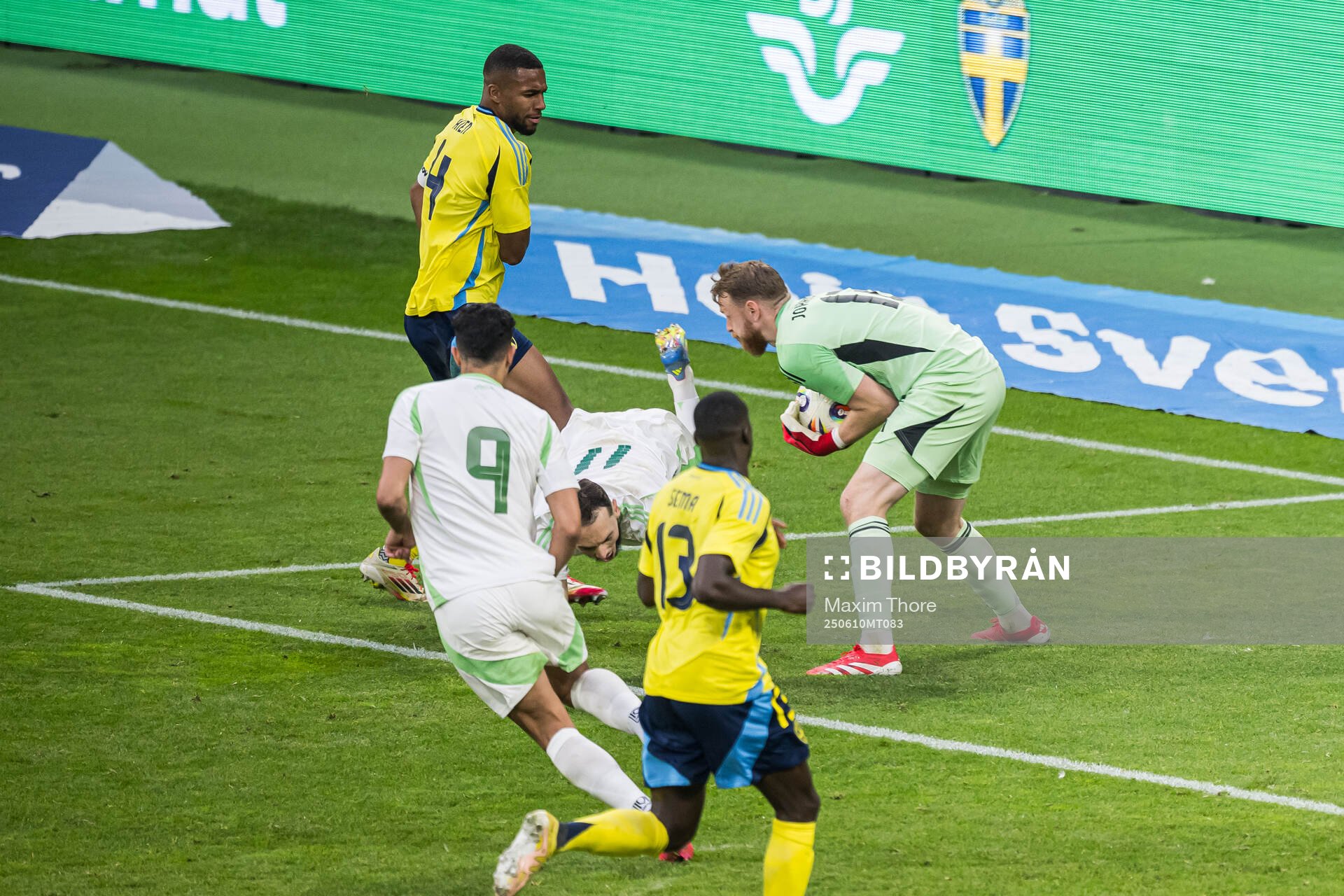 Isak Hien and goalkeeper Viktor Johansson of Sweden