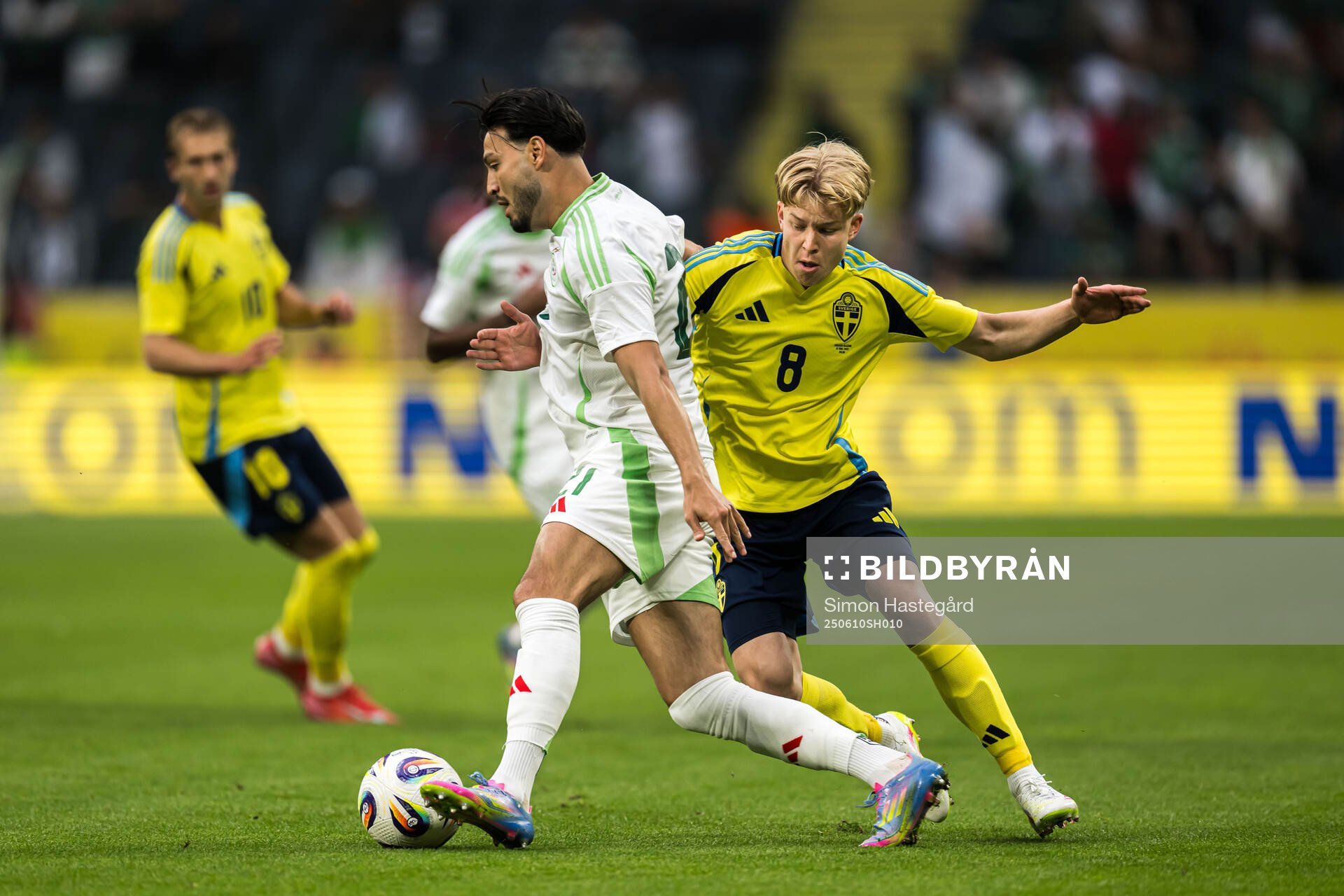 Ramy Bensebaini of Algeria and Daniel Svensson of Sweden