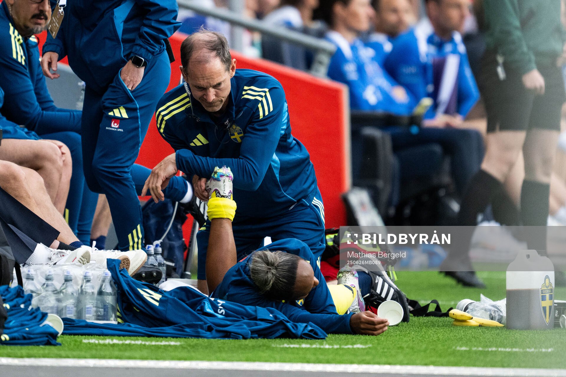 Madelen Janogy of Sweden receives medical attention