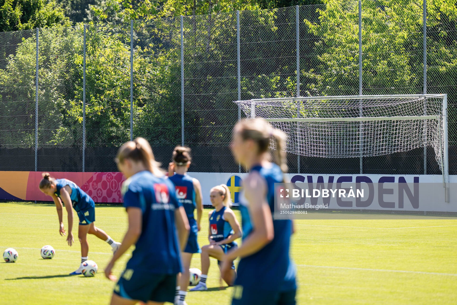 A board at the pitch of the Swedish women's national