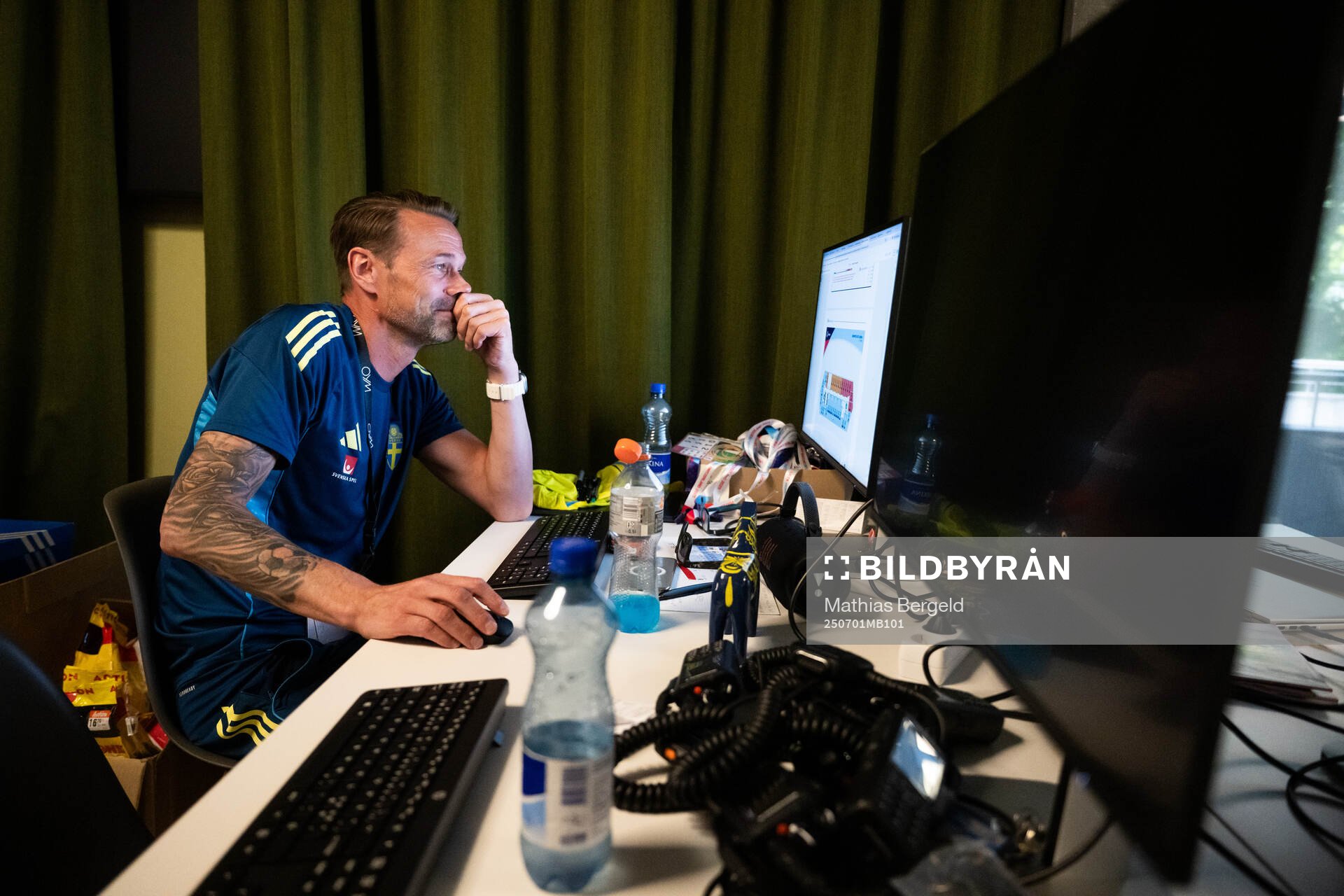 Coordinator Magnus Andersson by his computer at a walk