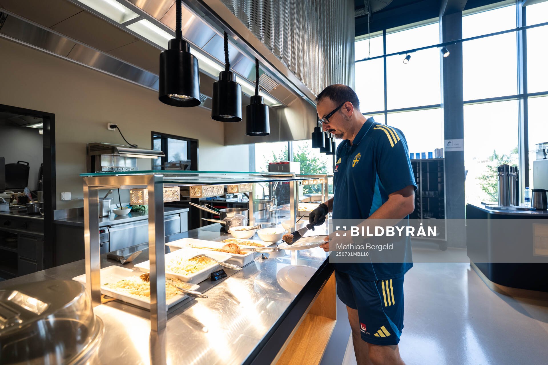 Medical doctor Houman Ebrahim takes food at a walk around