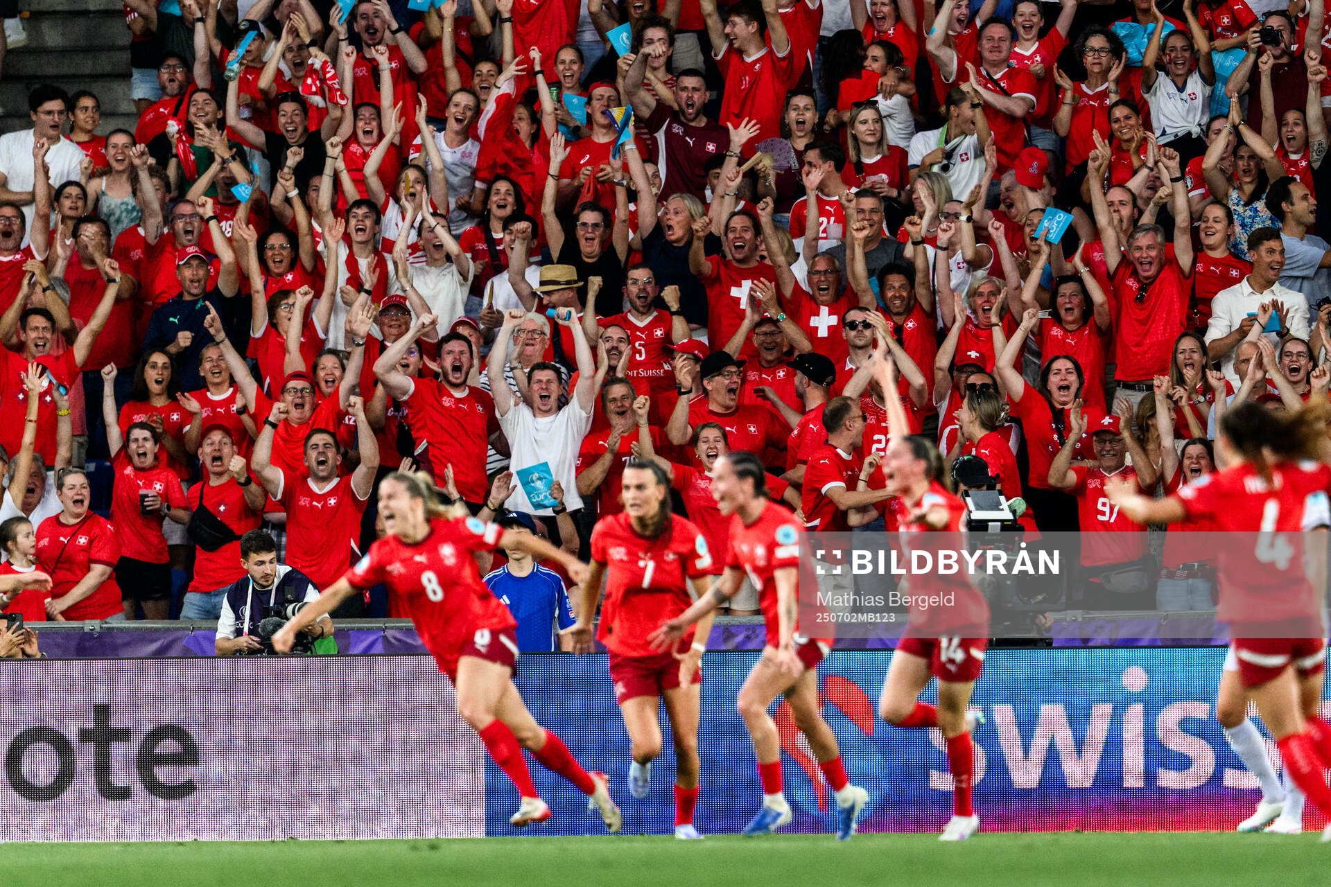 Fan of Switzerland celebrate 1-0 by Nadine Riesen of