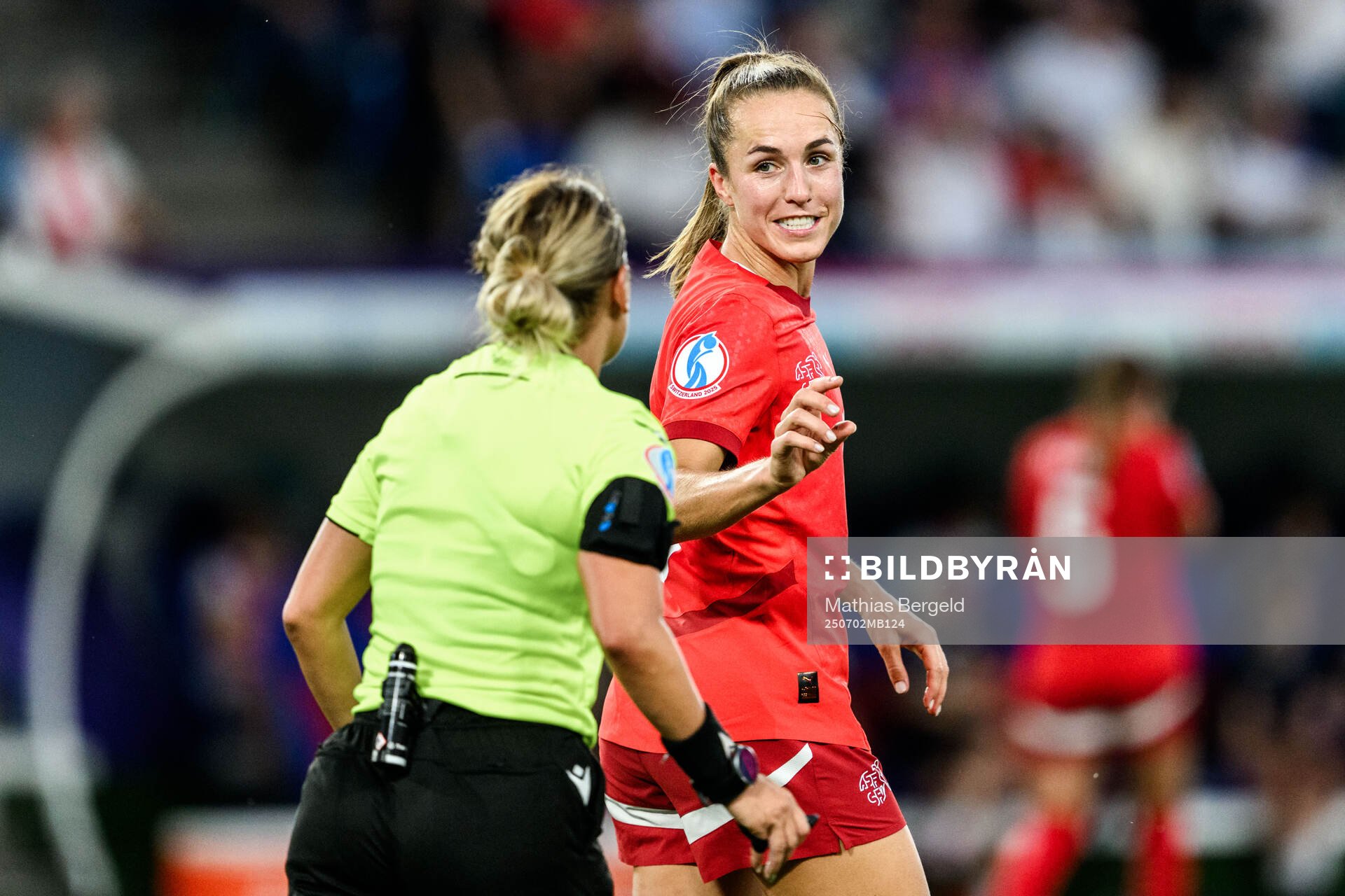 Referee Alina Pesu and Lia Wälti of Switzerland