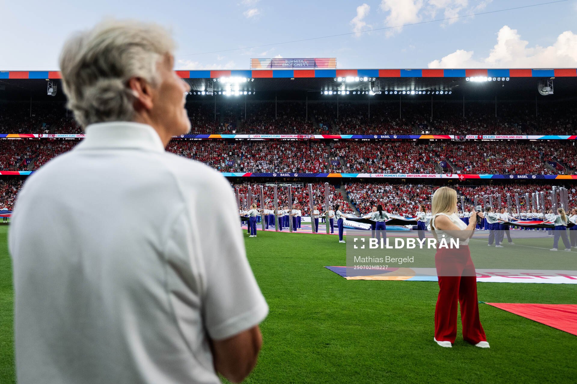 Spectators is seen behind Head coach Pia Sundhage of